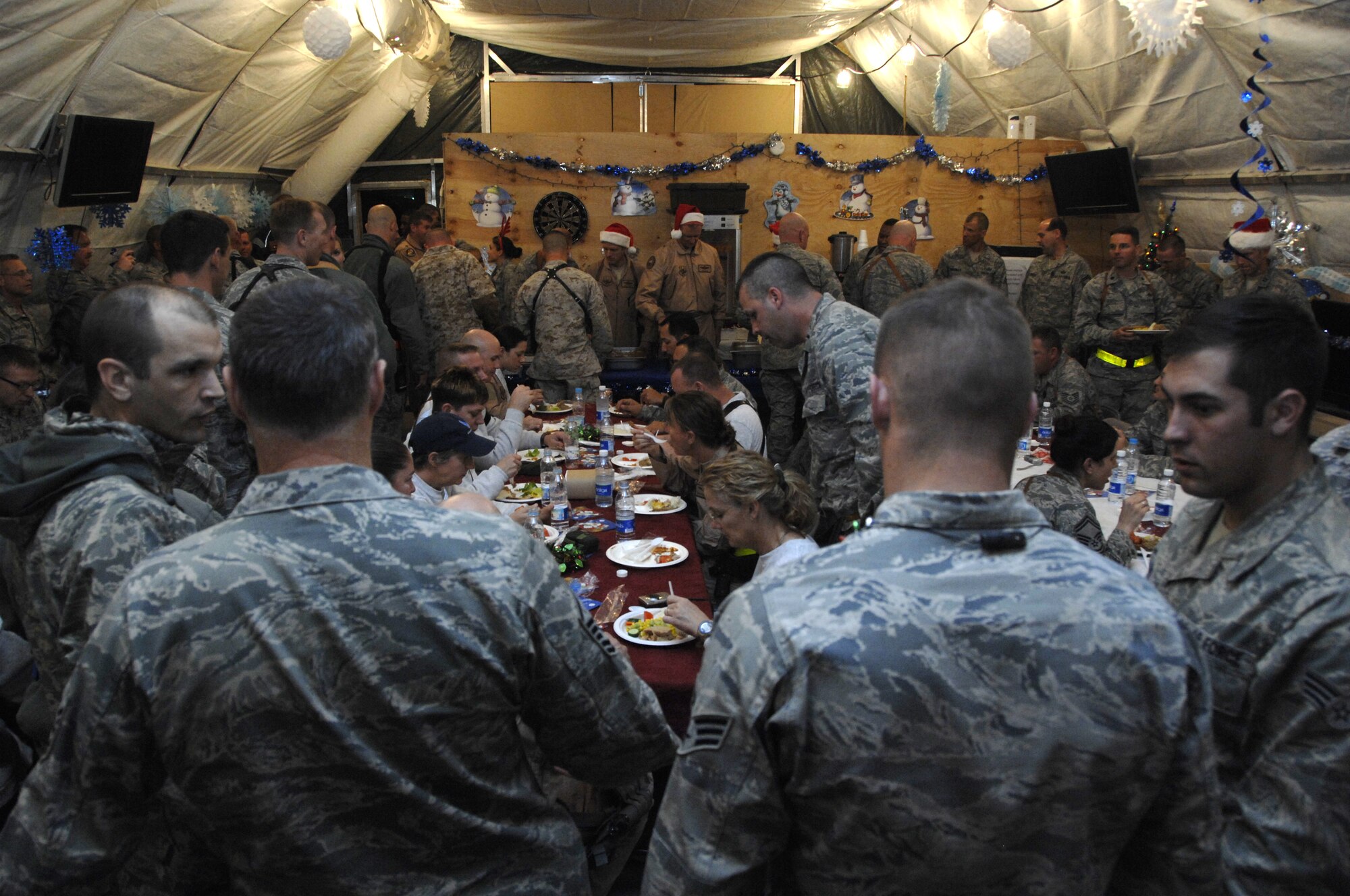 KANDAHAR AIRFIELD, Afghanistan -- Airmen of the 451st Air Expeditionary Wing crowded the recreation tent on Camp Samek to enjoy Christmas Eve with their Air Force family.  (U.S. Air Force photo/Staff Sgt. Angelique N. Smythe)
