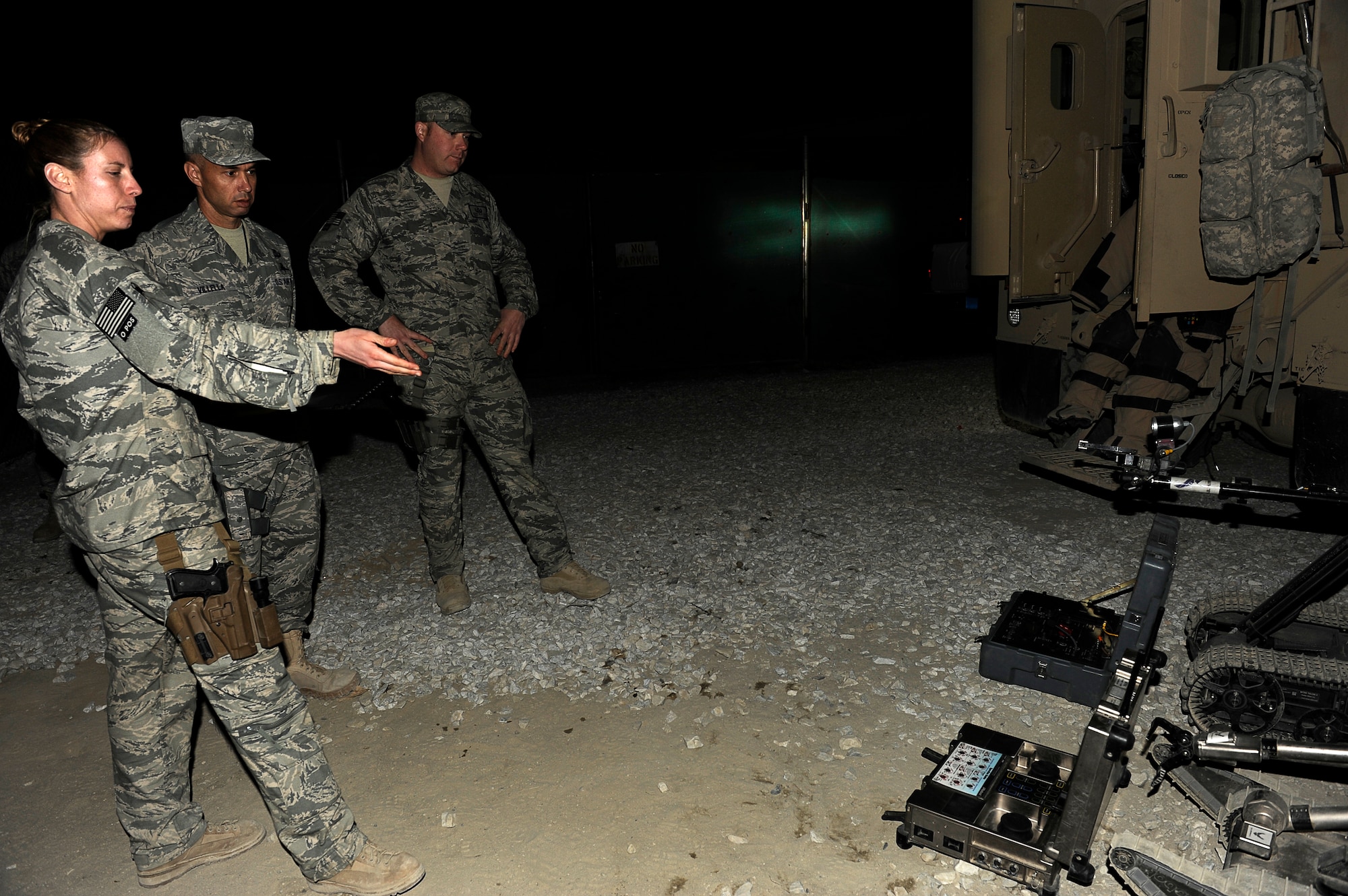 BAGRAM AIRFIELD, Afghanistan--U.S. Air Force Staff Sgt. Liz Spradley 755 Air Expeditionary Group, Explosive Ordnance Disposal (EOD), Operation Location Alpha, demonstrates some of EOD's equipment to AFCENT Command Chief Mark Villella during his tour Dec. 29, 2009. (U.S. Air Force photo by: Tech. Sgt. Jeromy K. Cross)
