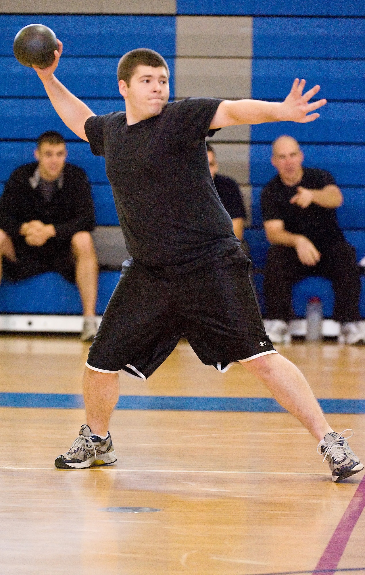 Airman 1st Class Micheal Clay, 436th Operations Support Squadron, prepares to throw a dodgeball during the Holiday Dodgeball Tournament Dec. 18 at the Fitness Center. (U.S. Air Force photo/ Roland Balik)