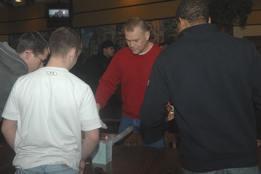 MINOT AIR FORCE BASE -- Chief Master Sergeant of the Air Force James Roy
hands out candy canes and meets with Airmen of the 5th Bomb Wing and 91st
Missile wing during a holiday social for dorm residents at the Minot Air
Force Base Community Center Dec.24.  Chief Master Sergeant Roy spent part of
the Christmas weekend at Minot as part of a morale visit to tell Airmen
their work in the nuclear enterprise is critical and that the Air Force is
committed to their development. Chief Roy's visit marks his first trip to
Minot AFB as CMSAF. He is the 16th CMSAF and holds the highest enlisted
level of leadership in the Air Force. (U.S. Air Force photo by Senior Airman
Jesse Lopez)
