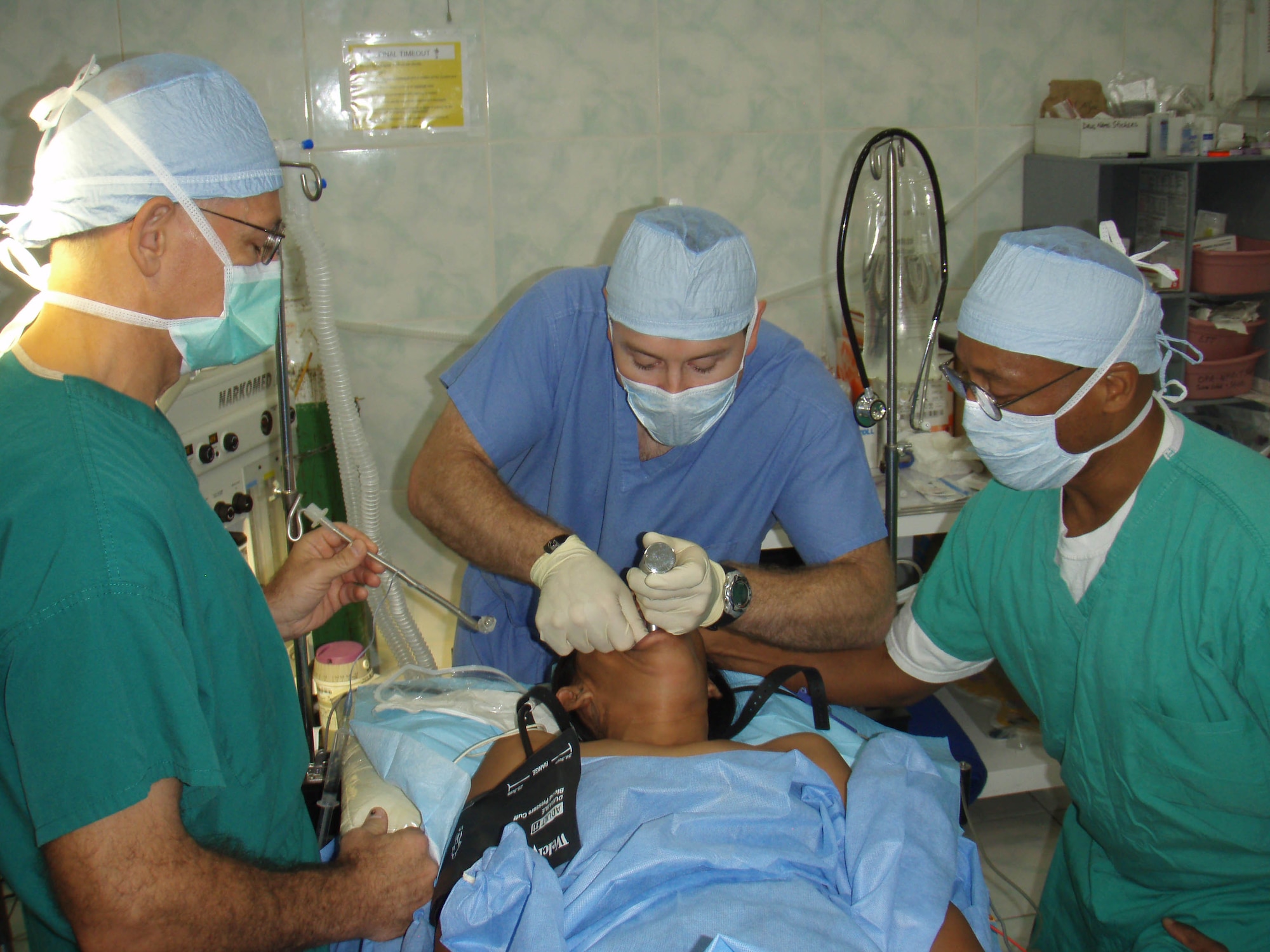 Col. Michael Restey (left) helps his Forward Surgical Team with a procedure during his deployment to Joint Special Operations Task Force-Philippines.  Colonel Restey, deployed from the 96th Medical Group, leads the five-person Air Force team.  (Courtesy photo.)