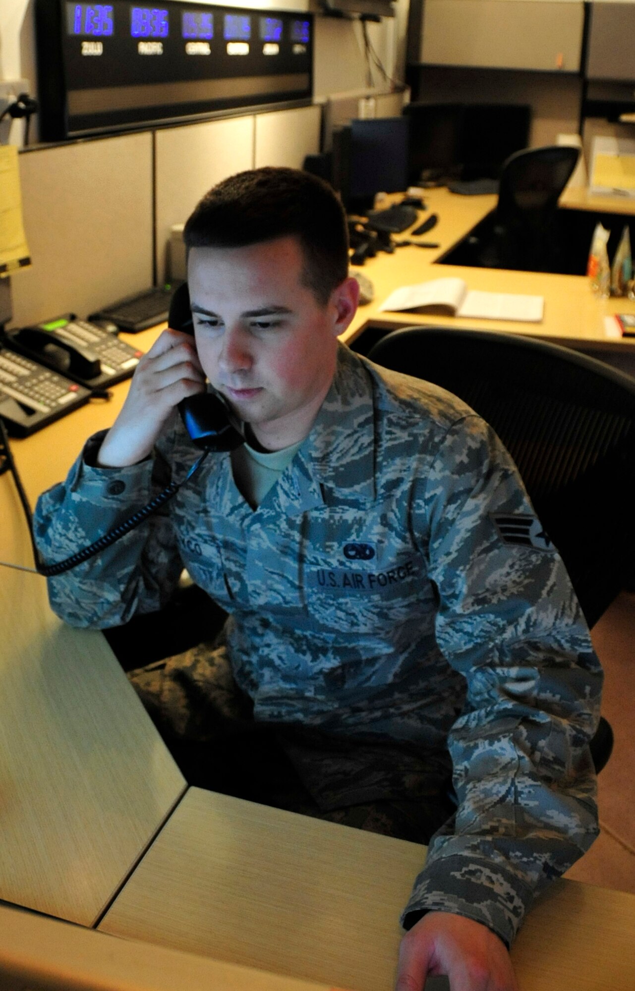 Senior Airman Stephen Babayco, 380th Expeditionary Equipment Maintenance Squadron maintenance operations controller, coordinates support activity for the flightline at a non-disclosed location in Southwest Asia on Dec. 28, 2009. Airman Babayco is deployed from Beale Air Force Base, Calif., and his hometown is San Ramon, Calif. (U.S. Air Force Photo/Senior Airman Jenifer H. Calhoun)