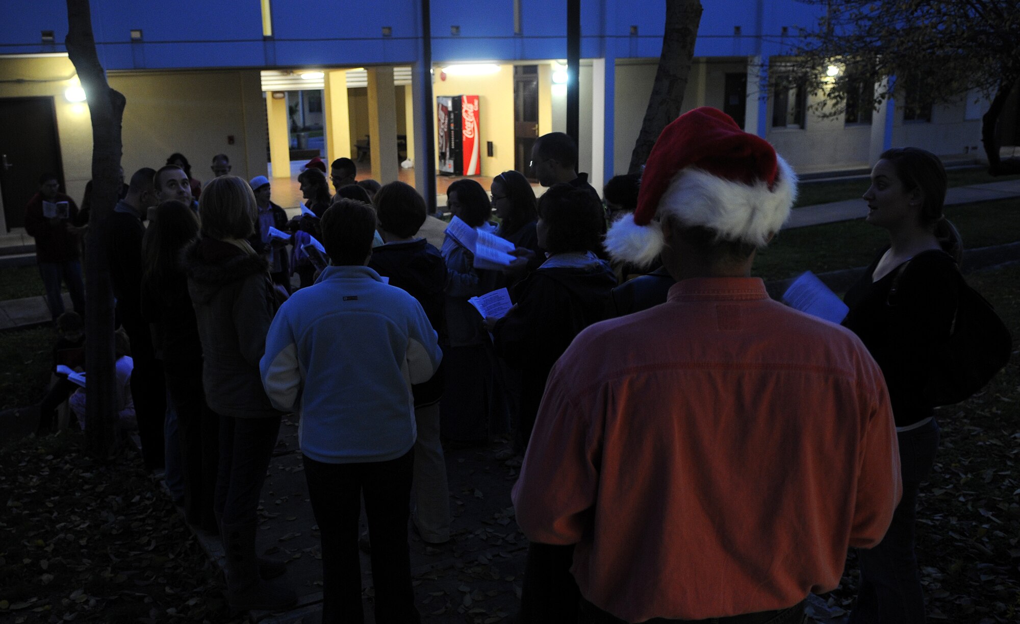 Nearly 30 volunteers from the base chapel sing carols to unaccompanied Incirlik Airmen residing in the dorms Sunday, Dec. 20, 2009 at Incirlik Air Base, Turkey. Holiday classics such as “Rudolph the Red-nosed Reindeer” and “We Wish You a Merry Christmas” were among the songs performed. (U.S. Air Force Photo/Senior Airman Alex Martinez)