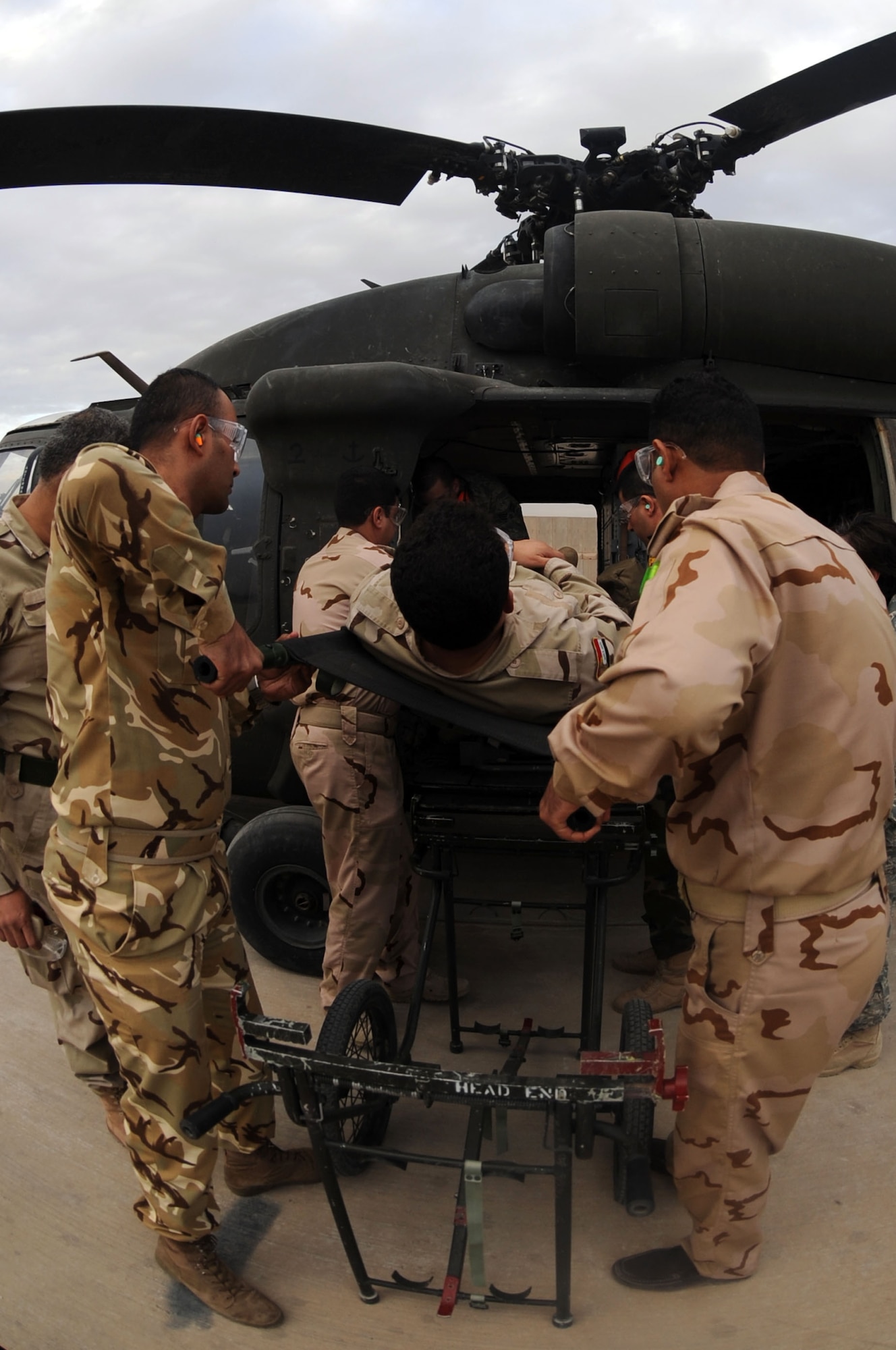 JOINT BASE BALAD, Iraq – Iraqi air force members put their skills to the test during medical evacuation training Dec. 21, 2009, at the Air Force Theater Hospital. The main focus of the training was to teach Ministry of Defense nurses and medics how to properly load and unload ambulatory patients from an aircraft. (U.S. Air Force photo/Senior Airman Brittany Y. Bateman)