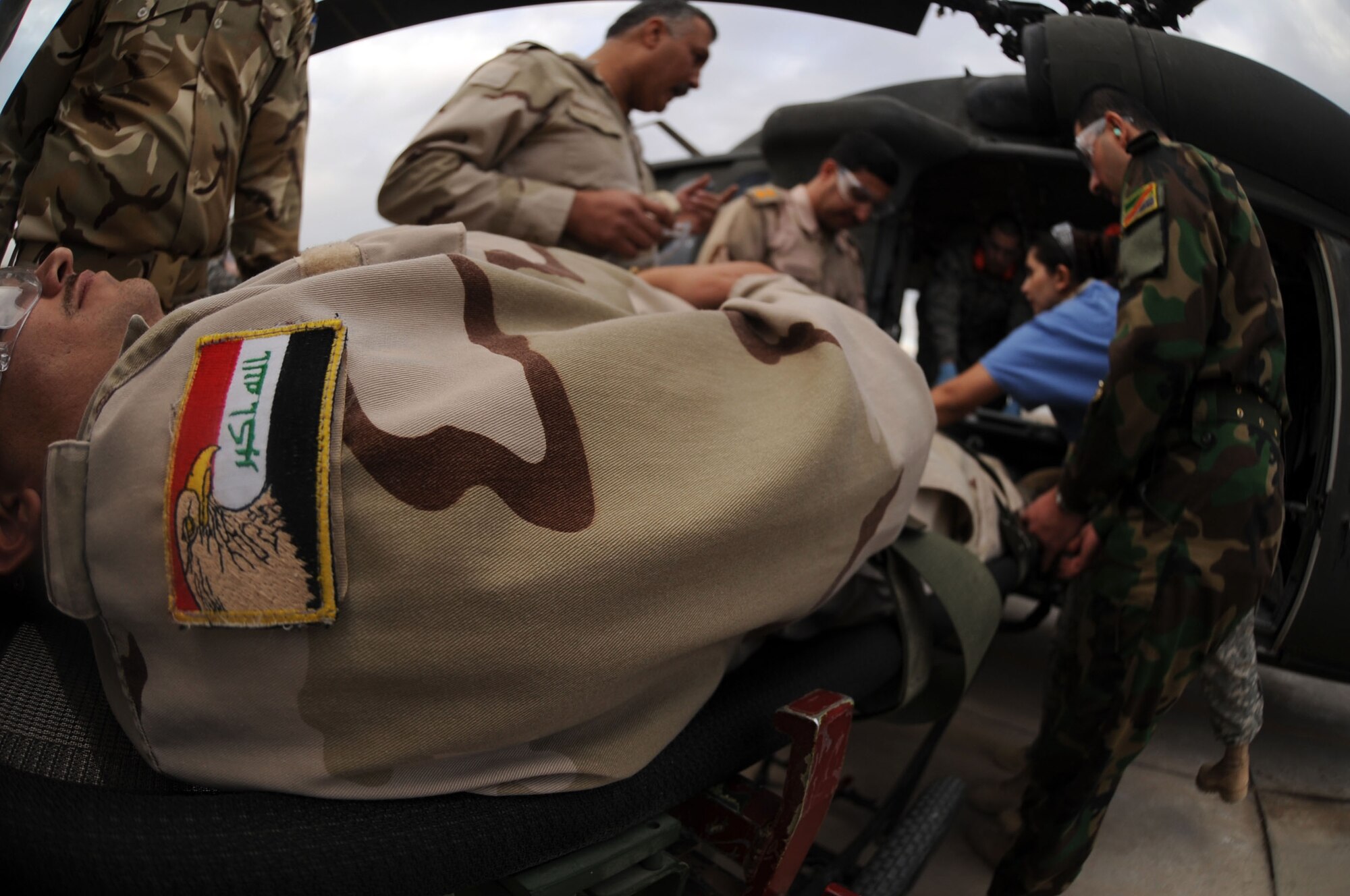JOINT BASE BALAD, Iraq – Iraqi air force members put their skills to the test during medical evacuation training Dec. 21, 2009, at the Air Force Theater Hospital. The purpose of the training is to help the Ministry of Defense strengthen its health care system for Iraqi troops. (U.S. Air Force photo/Senior Airman Brittany Y. Bateman)