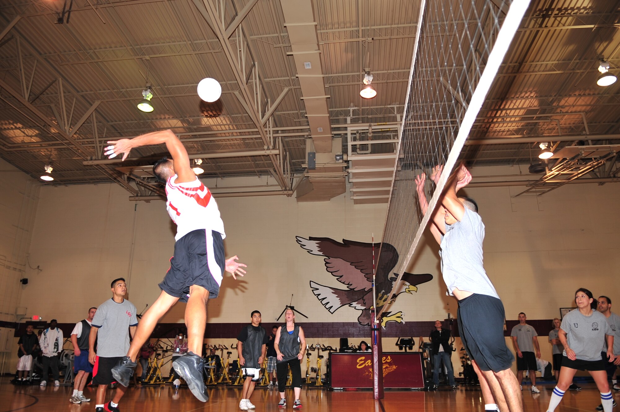 Chito Casignia, 4th Logistical Readiness Squadron, spikes the ball during an intramural volleyball championship game on Seymour Johnson Air Force Base, N.C., Dec. 21, 2009. Airmen and civilians from both squadrons competed in the tournament. (U.S. Air Force photo/Airman 1st Class Rae Perry)
