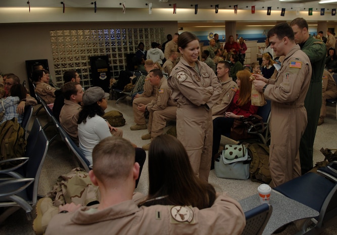 Airmen from the 14th Airlift Squadron visit with family and friends while awaiting departure for their four month deployment Dec. 28 at the passenger terminal here. The squadron is deploying to the Middle East in support of Operations Iraqi and Enduring Freedom.  (U.S. Air Force photo/Airman 1st Class Lauren Main)