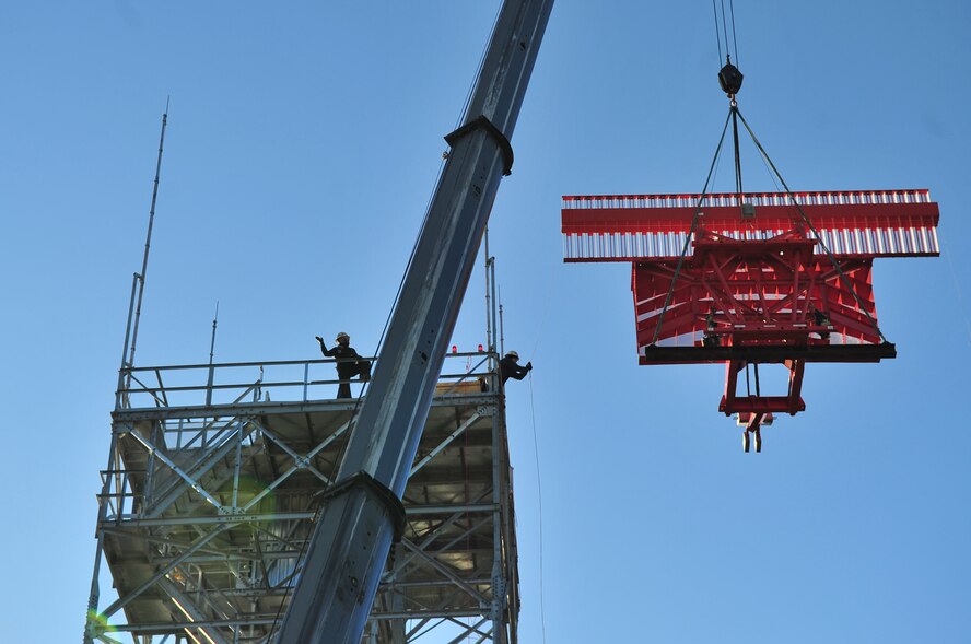 Members of Todd Hamilton Tower Services lift radar receivers for the new Digital Airport Surveillance Radar into place on Seymour Johnson Air Force Base, N.C., Dec.  17, 2009. The new tower will improve aircraft detection capabilities during flight. (U.S. Air Force photo/Airman 1st Class Rae Perry)