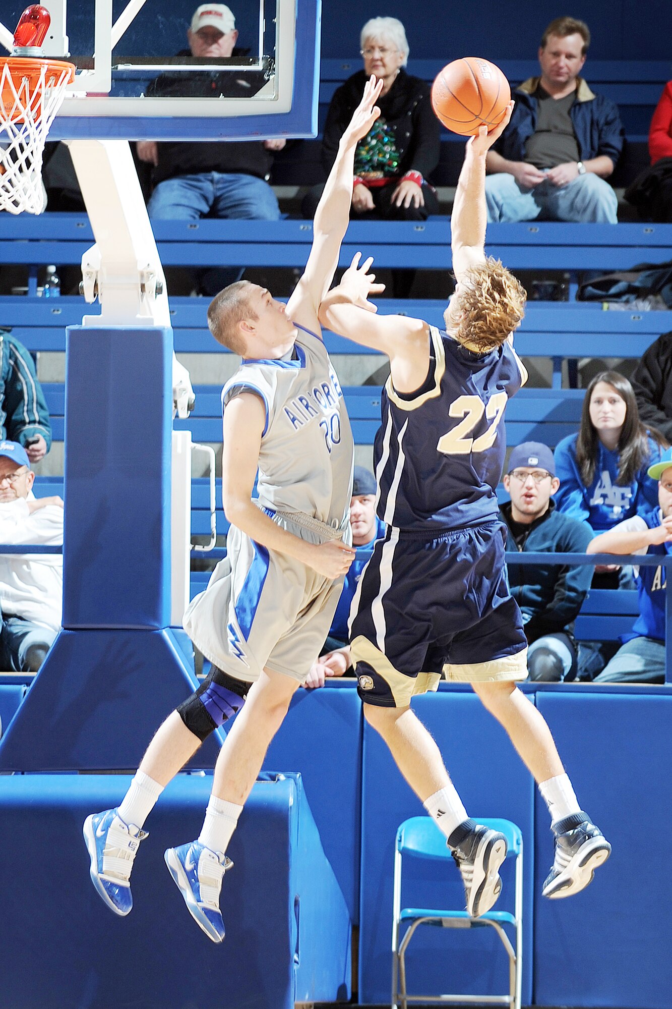 Junior forward Tom Fow rises high to block the shot attempted by University of California-Davis guard Joe Harden Dec. 22, 2009, at the U.S. Air Force Academy, Colo. Fow played what Air Force coach Jeff Reynolds called the best defensive game he's played all year.   (U.S. Air Force photo/Bill Evans)
