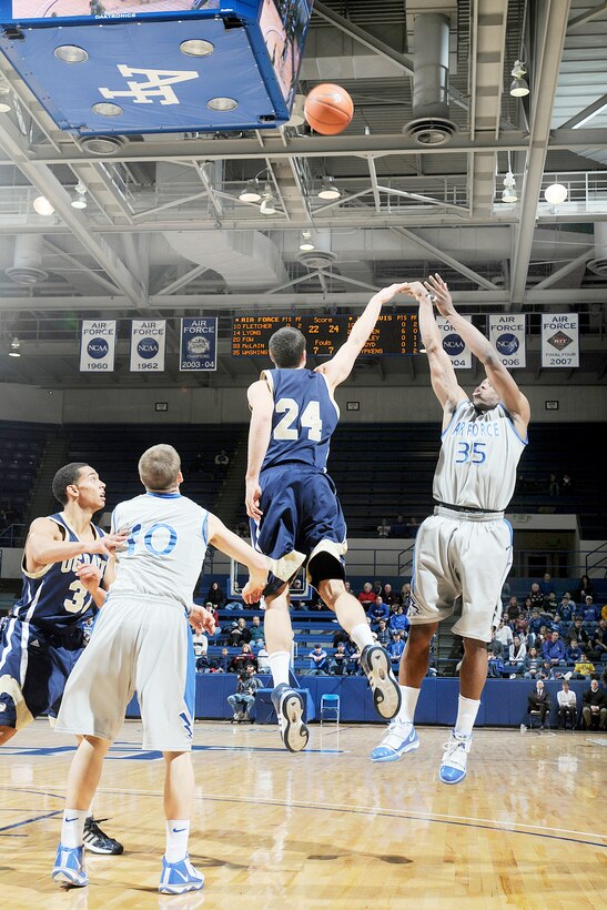 At the U.S. Air Force Academy, Colo., junior guard Evan Washington shoots for 2 of his 10 points as the Falcons rally to defeat University of California-Davis 69-57 Dec. 22, 2009. Through ten games this season, Washington is averaging 12 points per contest.  (U.S. Air Force photo/Bill Evans)