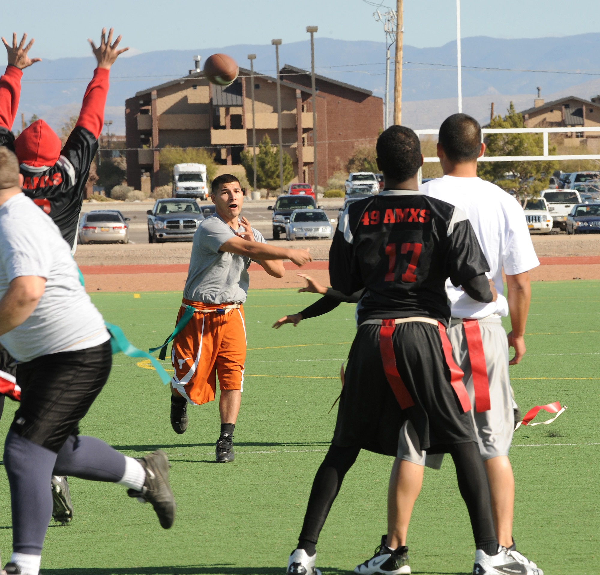 HOLLOMAN AIR FORCE BASE, N.M. -- Richard Pantoja, quarterback for the 49th Maintenance Squadron, passes the ball downfield during the Flag Football Championship game Dec. 19. The 49th MXS threw an interception in the second half that nearly cost them the game, but they were able to come back to win 27 - 20 against the 49th Aircraft Maintenance Squadron. (U.S. Air Force photo by Airman 1st Class Sondra Escutia)