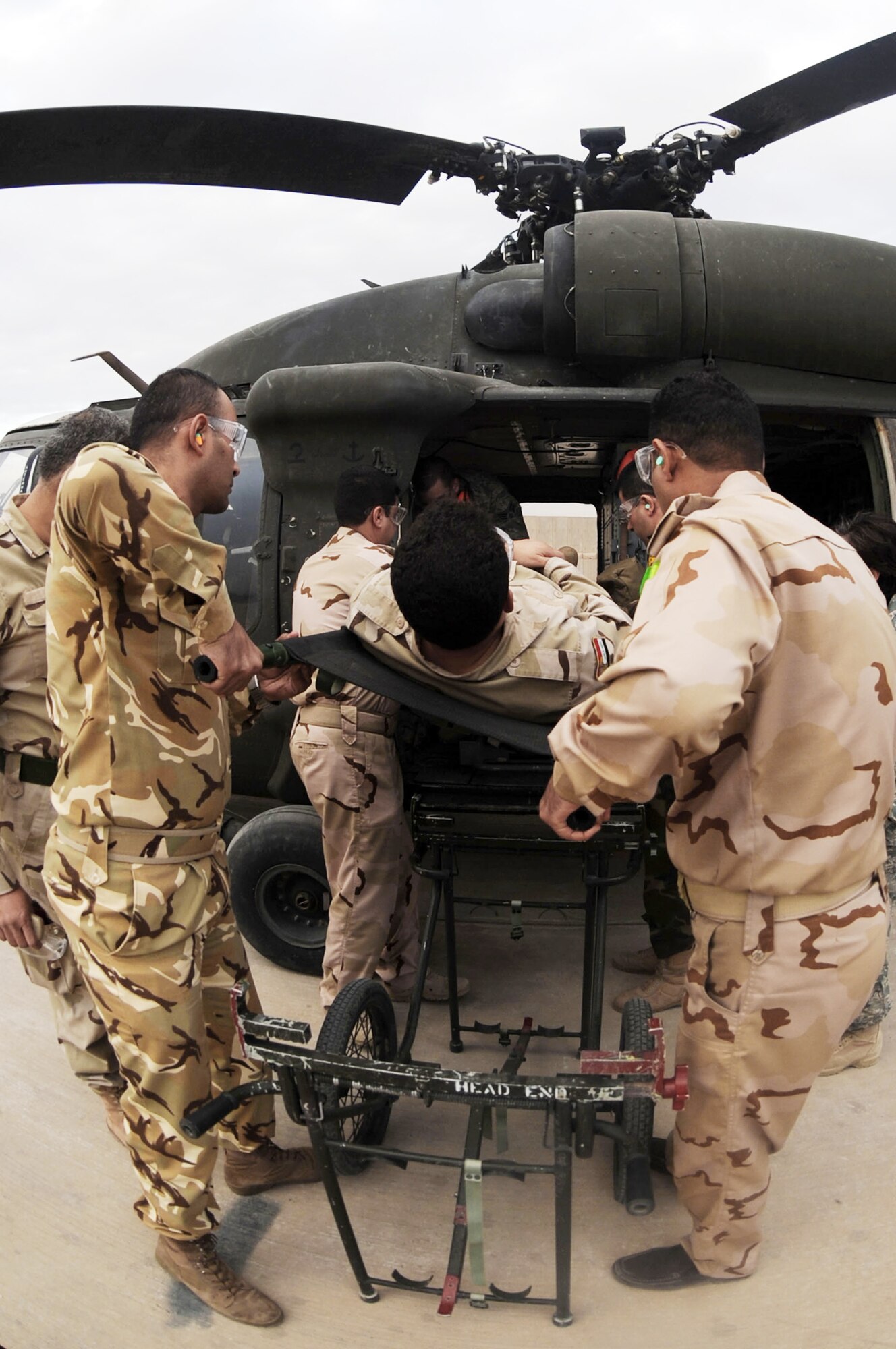 Iraqi air force airmen put their skills to the test during medical evacuation training Dec. 21, 2009, at the Air Force Theater Hospital at Joint Base Balad, Iraq. The main focus of the training was to teach Ministry of Defense nurses and medics to properly load and unload ambulatory patients from an aircraft. (U.S. Air Force photo/Senior Airman Brittany Bateman)