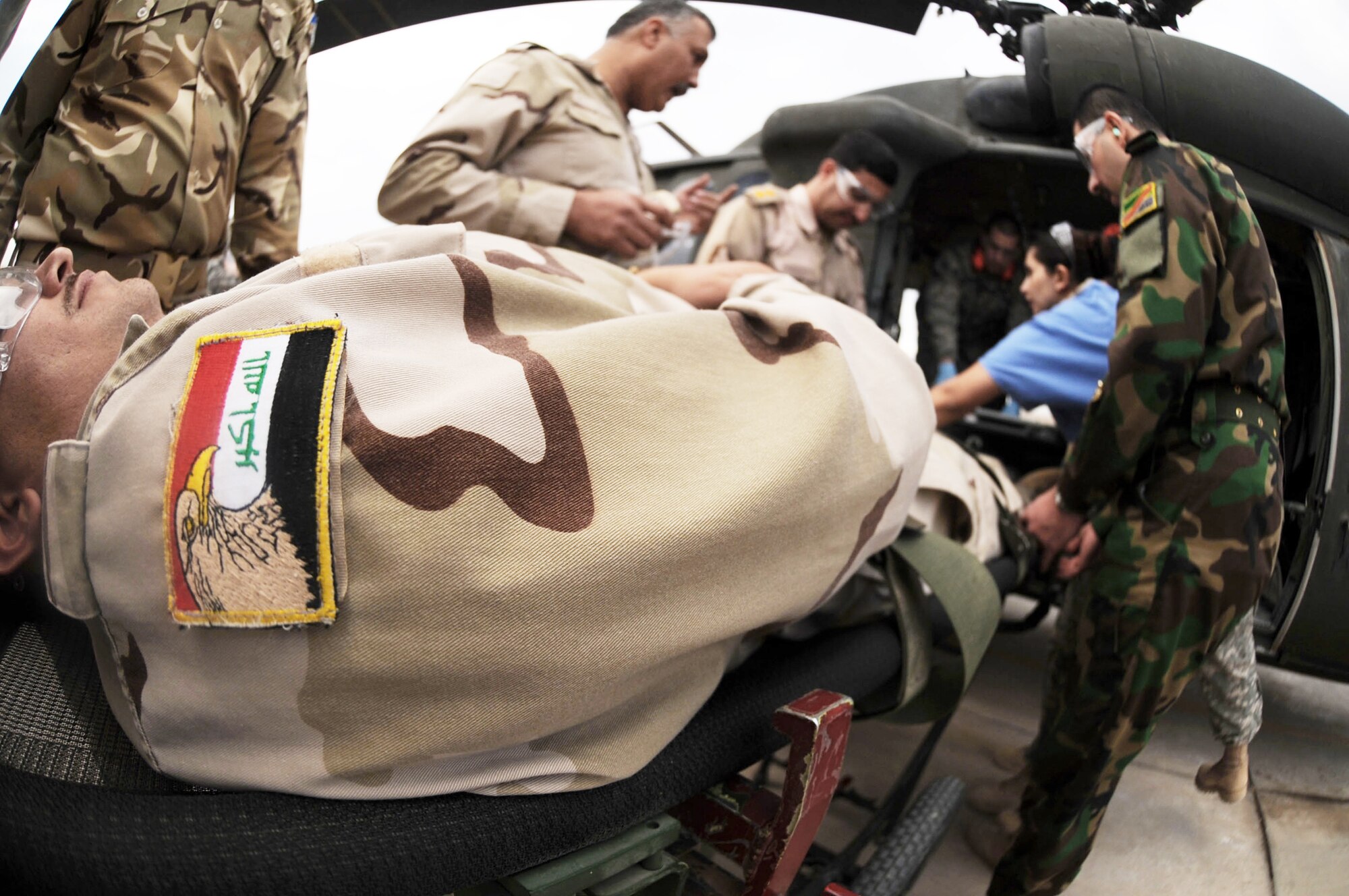 Iraqi air force airmen put their skills to the test during medical evacuation training Dec. 21, 2009, at the Air Force Theater Hospital, at Joint Base Balad, Iraq. The purpose of the training is to help Ministry of Defense officials strengthen their health care system for Iraqi troops. (U.S. Air Force photo/Senior Airman Brittany Bateman)