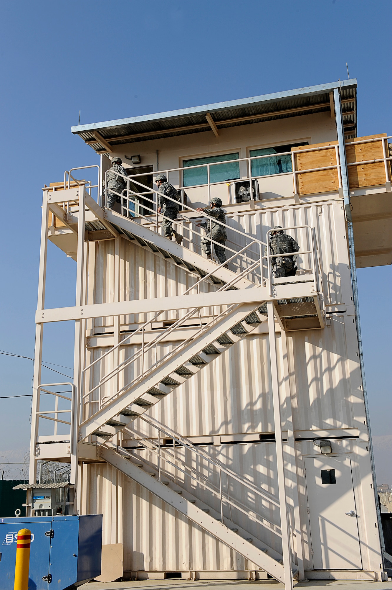 BAGRAM AIRFIELD, Afghanistan--U.S. Air Forces Central, Command Chief Master Sgt. Mark Villella climbs a guard tower.  Chief Villella toured the work areas of Airmen during his trip to Bagram Airfield, Dec. 30, 2009. (U.S. Air Force photo by: Tech. Sgt. Jeromy K. Cross)
