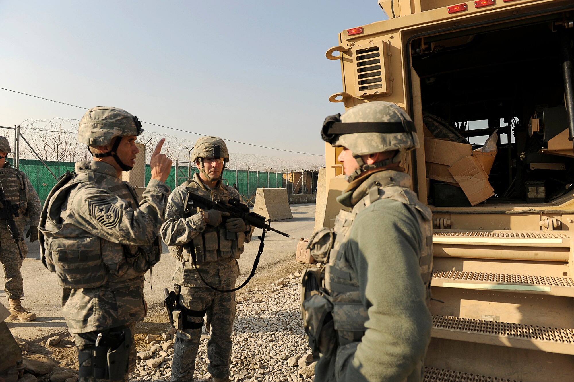 BAGRAM AIRFIELD, Afghanistan--U.S. Air Forces Central, Command Chief Master Sgt. Mark Villella talks with an Airman from the 455th Air Expeditionary Wing, Security Forces Squadron.  Chief Villella toured the work areas of Airmen during his trip to Bagram Airfield, Dec. 30, 2009. (U.S. Air Force photo by: Tech. Sgt. Jeromy K. Cross)
