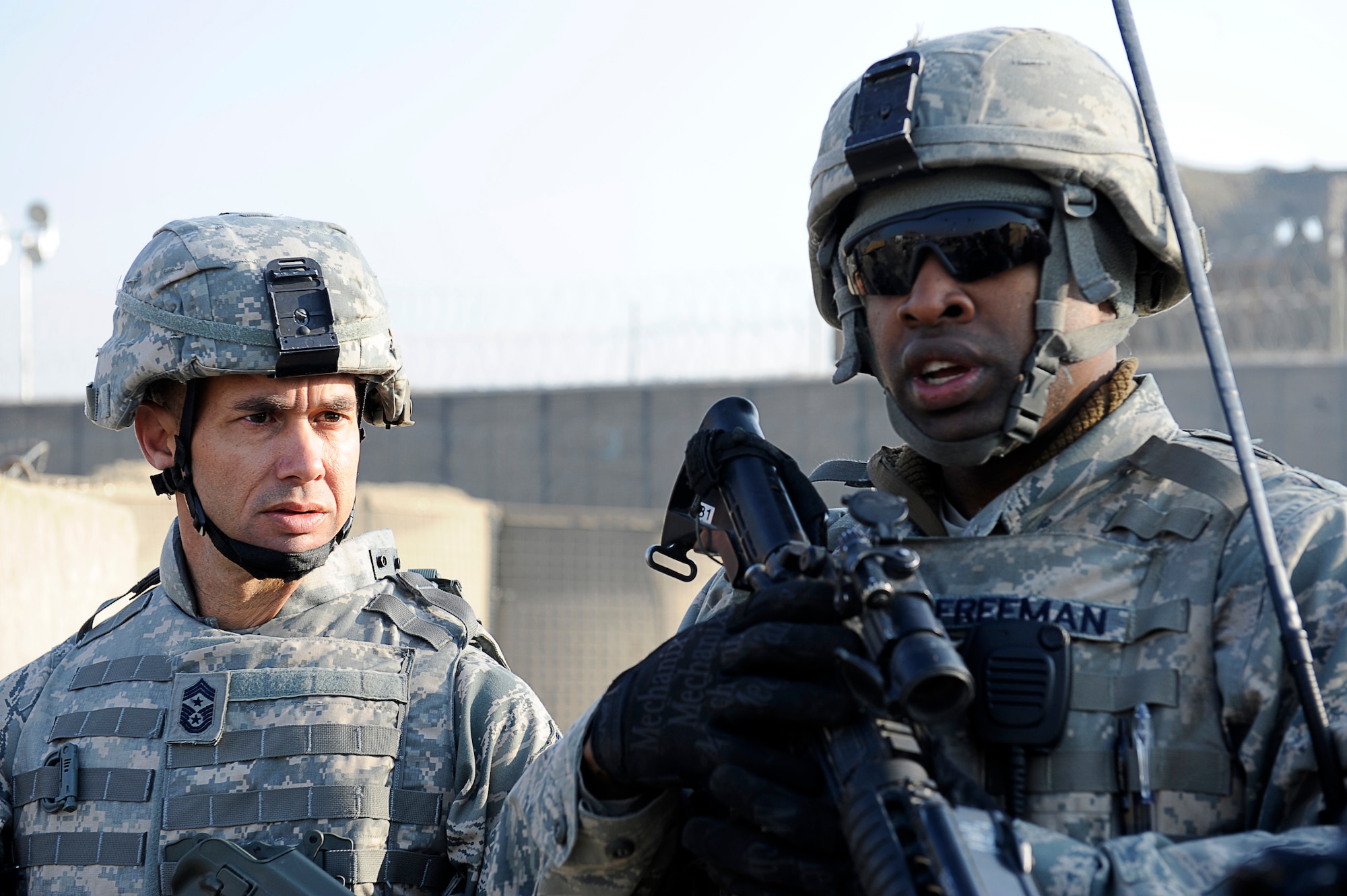 BAGRAM AIRFIELD, Afghanistan--U.S. Air Forces Central, Command Chief Master Sgt. Mark Villella talks with Air Force Staff Sgt. Cameron Freeman, 455th Air Expeditionary Wing, Security Forces Squadron.  Chief Villella toured the work areas of Airmen during his trip to Bagram Airfield, Dec. 30, 2009. (U.S. Air Force photo by: Tech. Sgt. Jeromy K. Cross)
