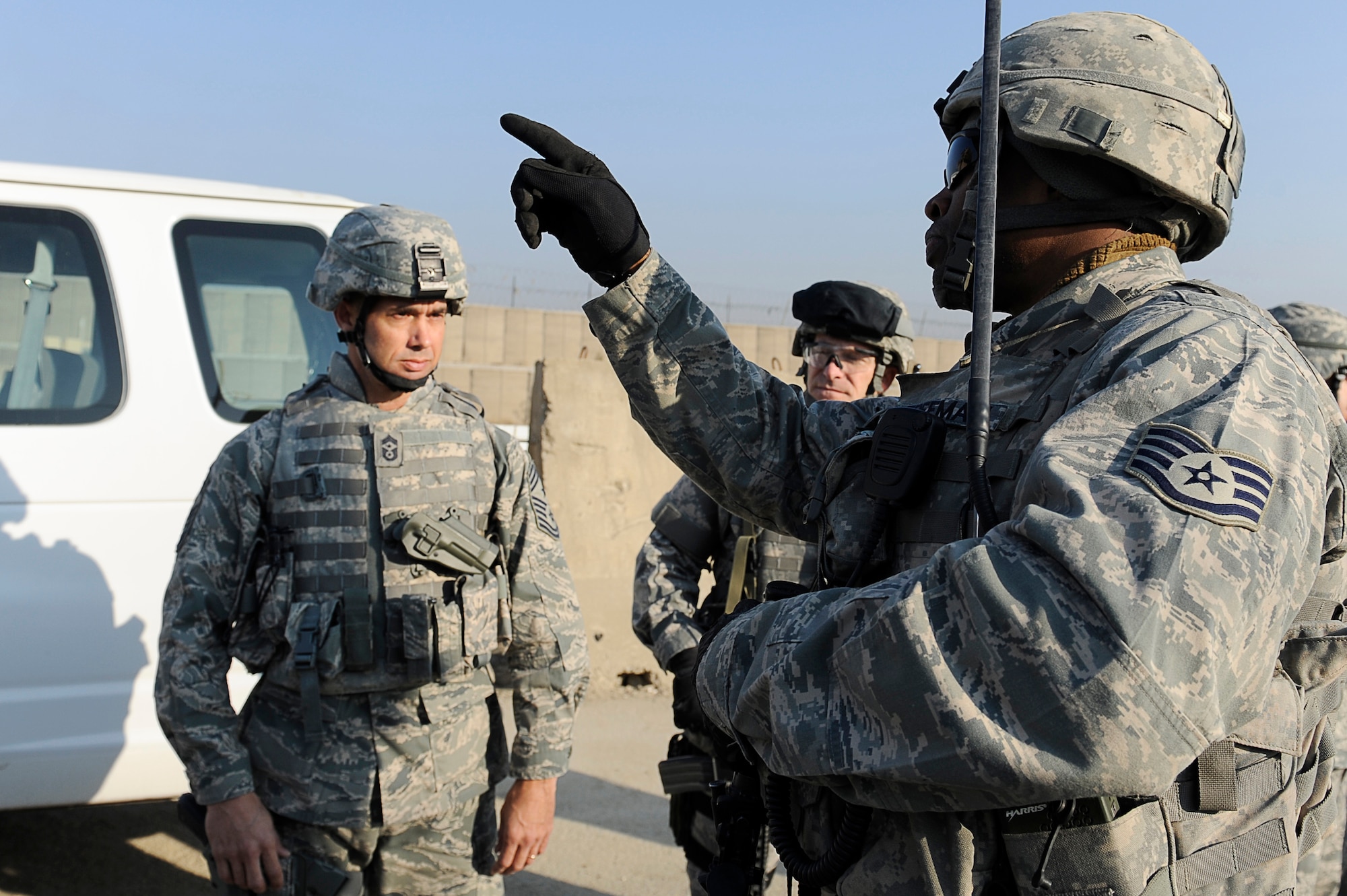 BAGRAM AIRFIELD, Afghanistan--U.S. Air Forces Central, Command Chief Master Sgt. Mark Villella talks with Air Force Staff Sgt. Cameron Freeman, 455th Air Expeditionary Wing, Security Forces Squadron.  Chief Villella toured the work areas of Airmen during his trip to Bagram Airfield, Dec. 30, 2009. (U.S. Air Force photo by: Tech. Sgt. Jeromy K. Cross)
