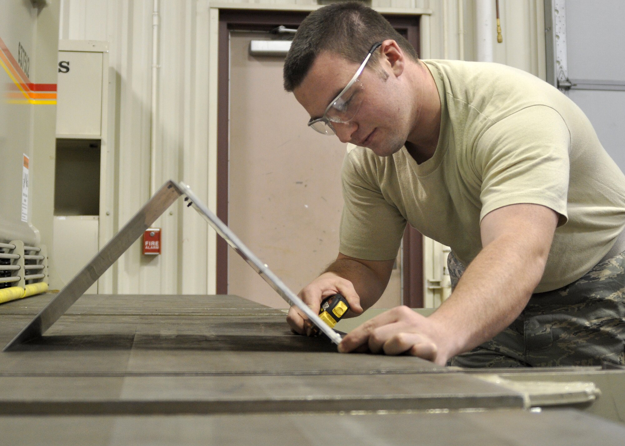 Airman 1st Class Alex Baker, an aircraft structural maintenance technician in the 917th Maintenance Squadron Fabrications Shop (MXMFS) at Barksdale Air Force Base, La., measures out a model piece for a project at the Fabrications Shop December 28, 2009. Airman Baker, an active duty Airman from the 2nd Bomb Wing here, has been in the 917th Fabrications Shop since July 2009 in support of Total Force Integration. Airmen Baker is just one of the Airmen responsible for the upkeep and repair of B-52 Stratofortresses and A-10 Thunderbolt IIs here on Barksdale. (U.S. Air Force Photo/ Senior Airman Crystal Marie Jordan)