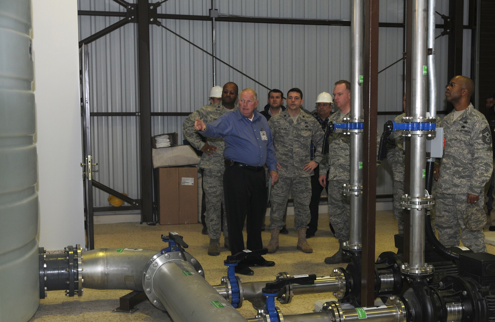 Tom Carneal, the deputy director of civil engineering for Vinnell Brown Root, explains the process of water filtration using Incirlik’s new Reverse Osmosis system to Col. Eric Beene, the 39th Air Base Wing commander, and other base leadership Wednesday, Dec. 30, 2009. Construction for this project took about eight months to complete. (U.S. Air Force photo/Senior Airman Ashley Wood)