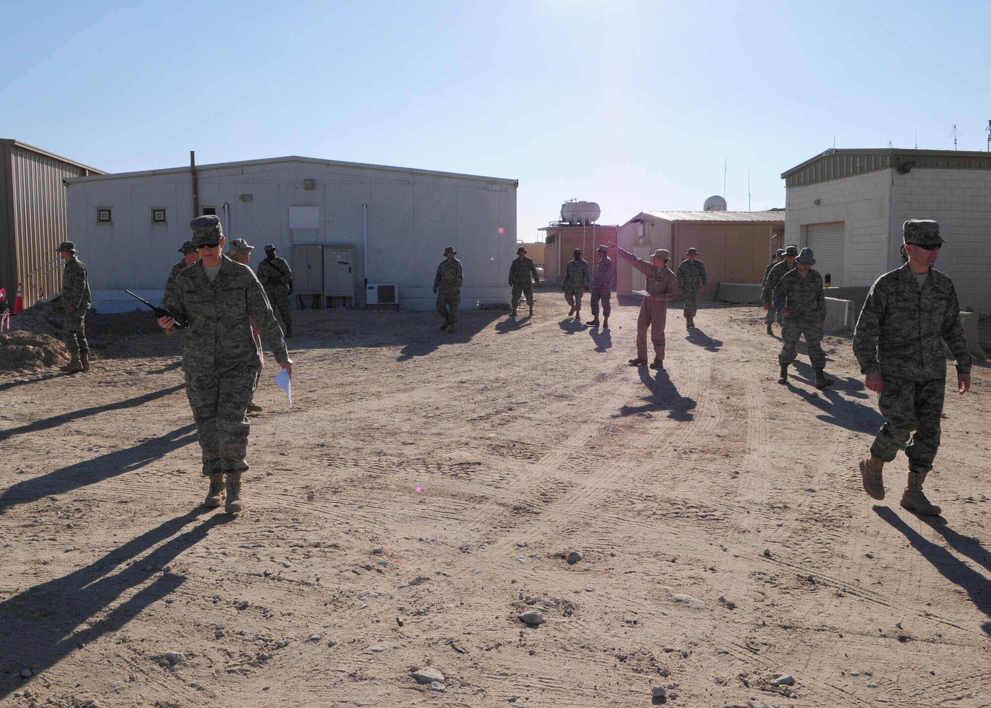 SOUTHWEST ASIA  -- Members of the 386th Air Expeditionary Wing post attack reconnaissance team conduct a practice PAR sweep of a designated area as part of a training class here Dec. 29, 2009. The training is a refresher course given to all personnel  to provide them with a general overview of PAR operations on base. (U.S. Air Force photo/Staff Sgt. Lakisha A. Croley)