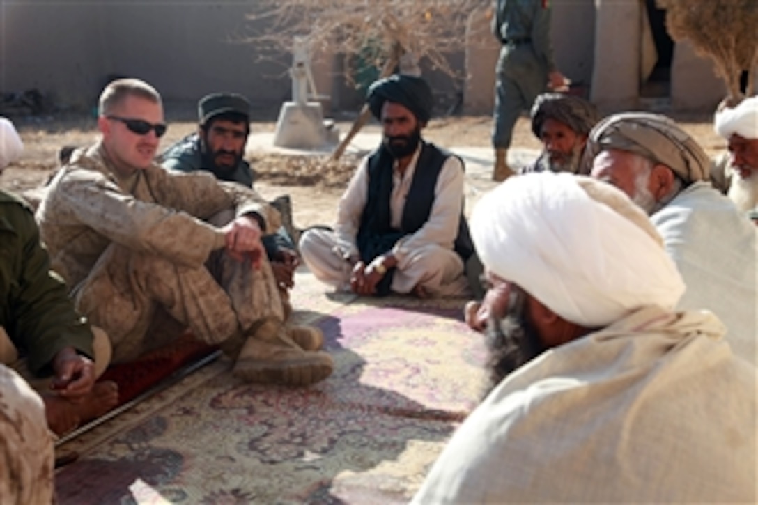 U.S. Marine Corps Capt. Jason C. Brezler, with 3rd Battalion, 4th Marine Regiment, meets with Afghan leaders in Now Zad, Afghanistan, on Dec. 15, 2009.  Marines meet with town elders to discuss the reconstruction process.  