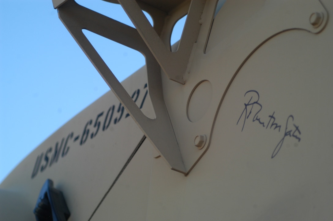 A Marine Corps vehicle signed by Secretary of Defense Robert Gates is displayed outside the pavilion of Amon G. Carter Stadium Dec. 30 on the campus of Texas Christian University during Adventure Zone festivities the day prior to the seventh annual Armed Forces Bowl, featuring the Air Force Academy Falcons squaring off against the University of Houston Cougars.