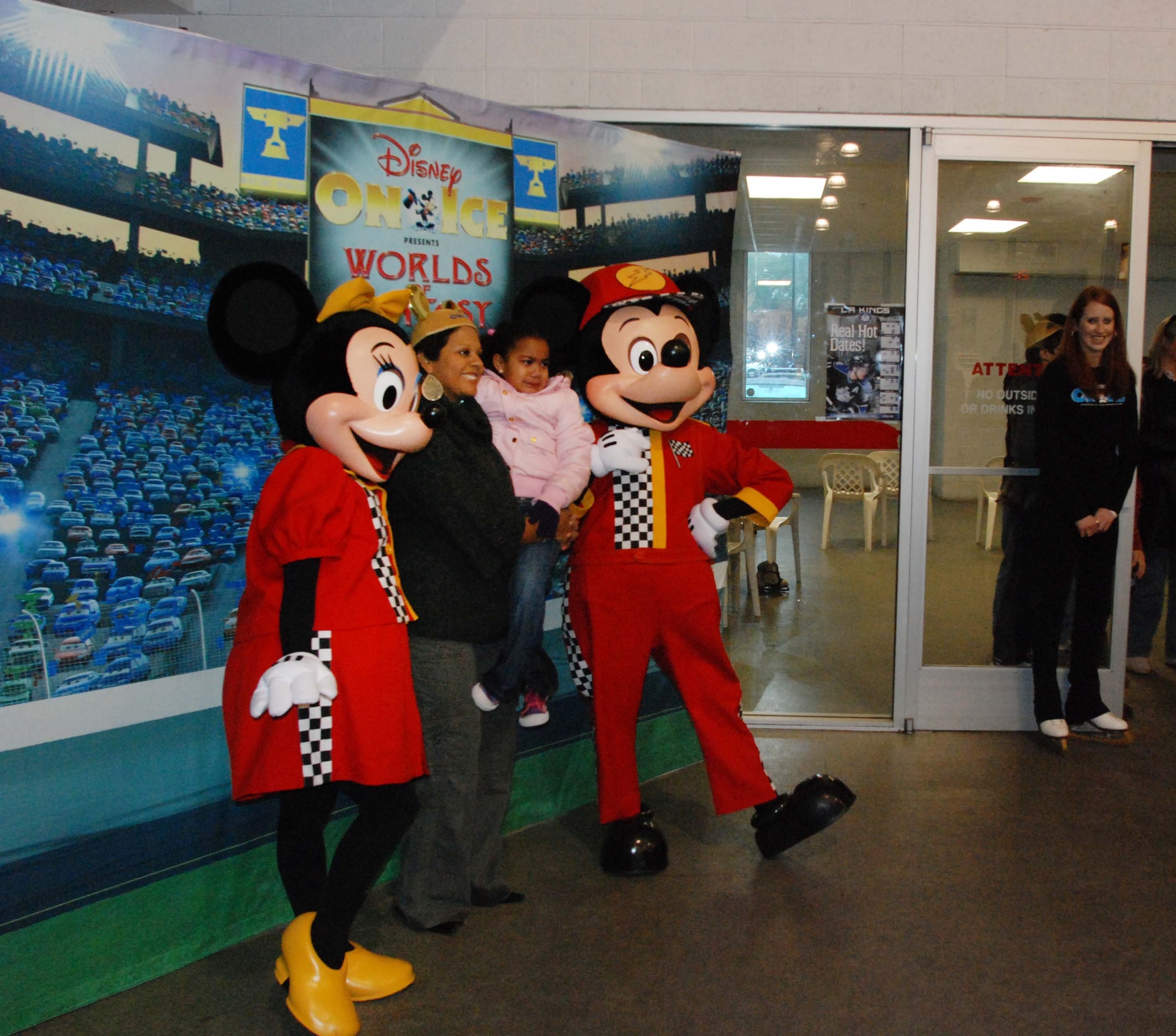 The children of March Air Reserve Base service members joined the performers of Disney on Ice Worlds of Fantasy for a free skating party at Center Ice in Ontario, Calif., Dec. 30, 2009.  After they skated with the performers, the children posed for pictures with Minnie and Mickey Mouse.  Many of the children will attend the show, which runs at Citizens Business Bank Arena in Ontario from Dec. 30 to Jan. 3, with complementary tickets.