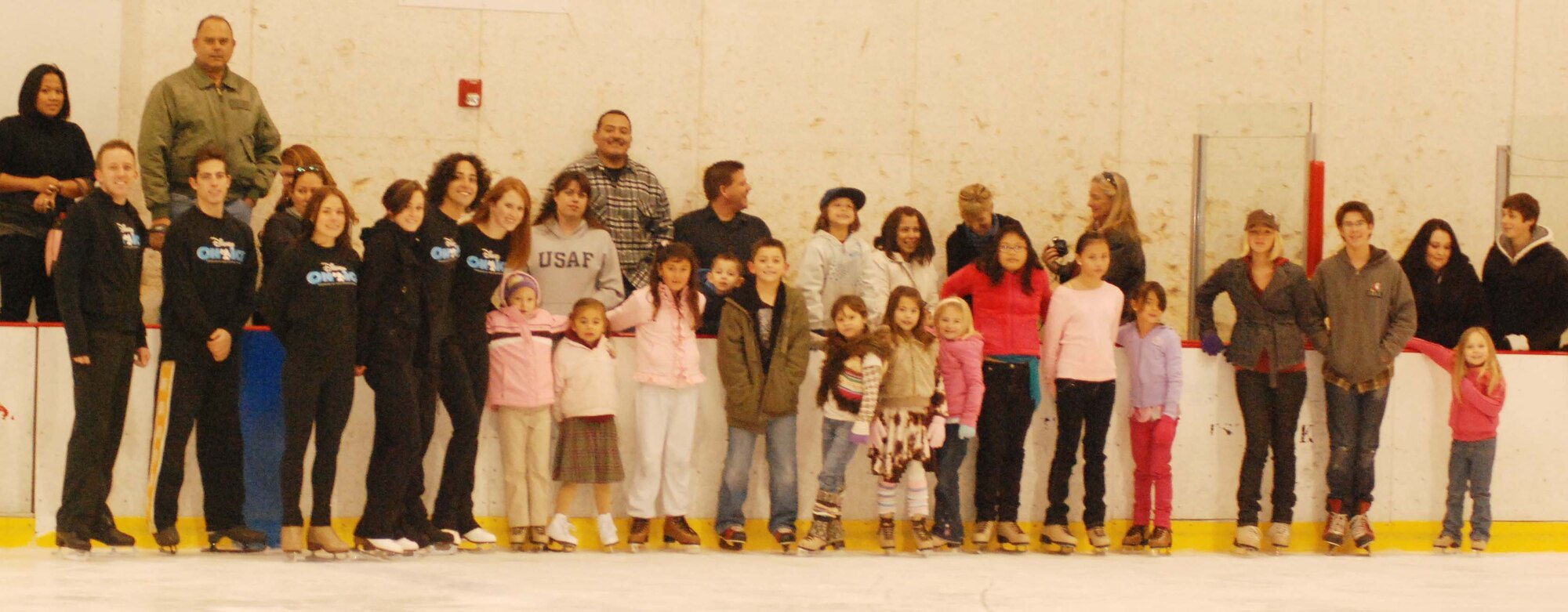 The children of March Air Reserve Base service members joined the performers of Disney on Ice Worlds of Fantasy for a free skating party at Center Ice in Ontario, Calif., Dec. 30, 2009.  After they skated with the performers, the children posed for pictures with Minnie and Mickey Mouse.  Many of the children will attend the show, which runs at Citizens Business Bank Arena in Ontario from Dec. 30 to Jan. 3, with complementary tickets.