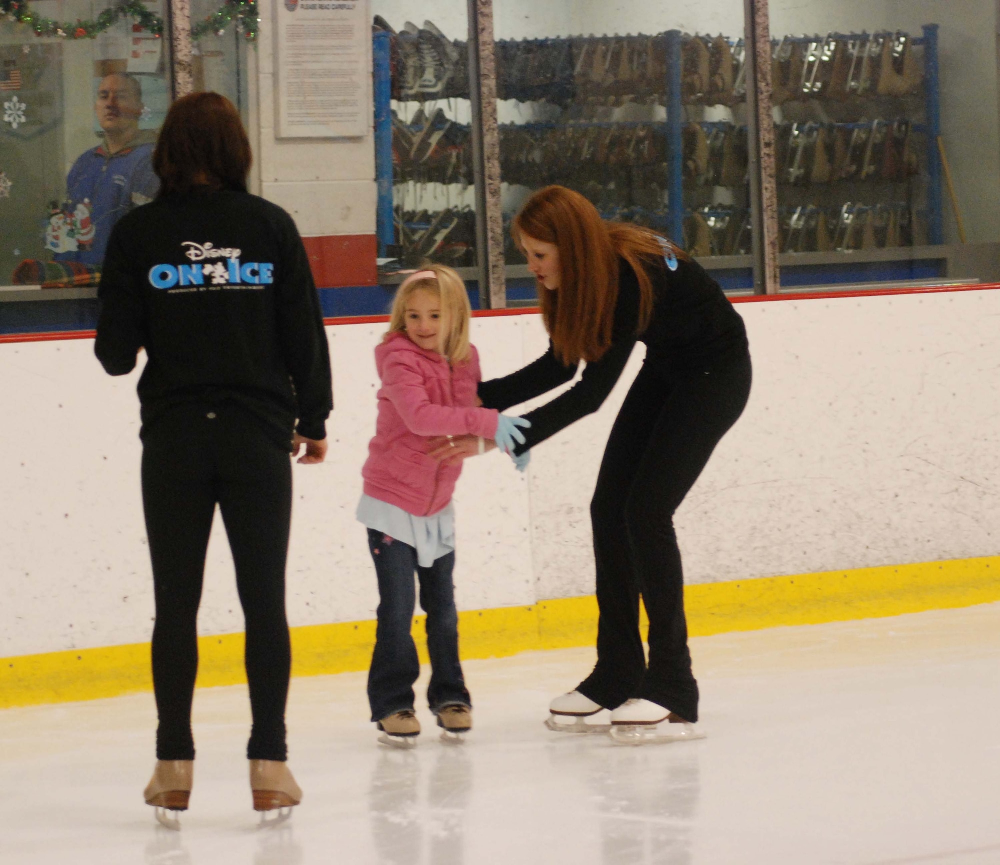 The children of March Air Reserve Base service members joined the performers of Disney on Ice Worlds of Fantasy for a free skating party at Center Ice in Ontario, Calif., Dec. 30, 2009.  After they skated with the performers, the children posed for pictures with Minnie and Mickey Mouse.  Many of the children will attend the show, which runs at Citizens Business Bank Arena in Ontario from Dec. 30 to Jan. 3, with complementary tickets.