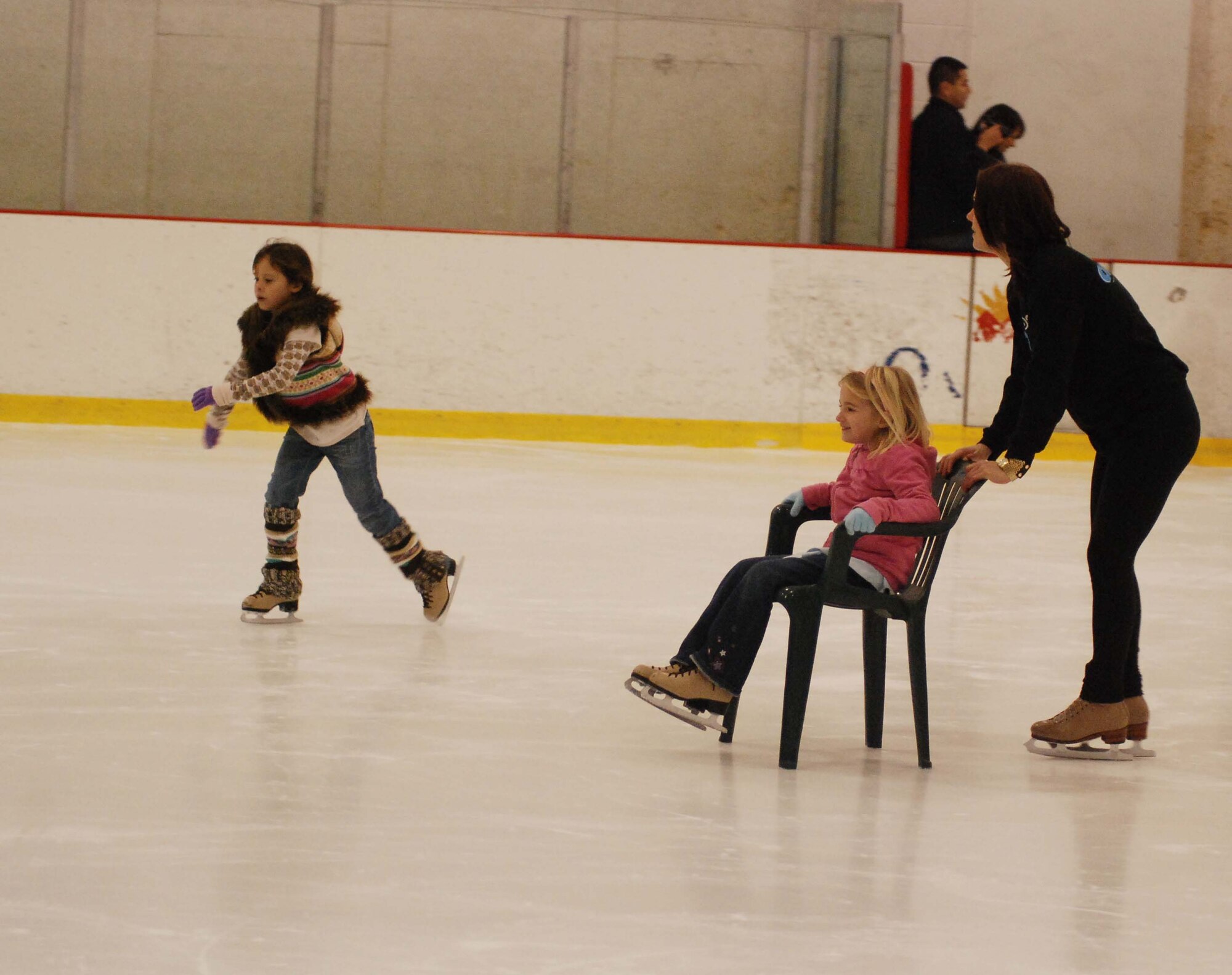 The children of March Air Reserve Base service members joined the performers of Disney on Ice Worlds of Fantasy for a free skating party at Center Ice in Ontario, Calif., Dec. 30, 2009.  After they skated with the performers, the children posed for pictures with Minnie and Mickey Mouse.  Many of the children will attend the show, which runs at Citizens Business Bank Arena in Ontario from Dec. 30 to Jan. 3, with complementary tickets.