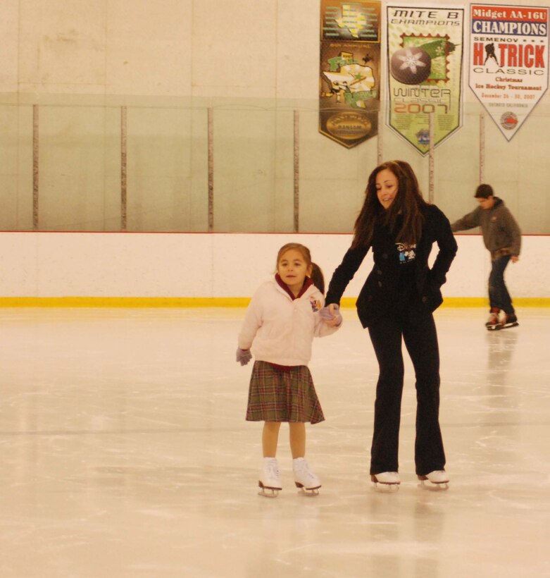 The children of March Air Reserve Base service members joined the performers of Disney on Ice Worlds of Fantasy for a free skating party at Center Ice in Ontario, Calif., Dec. 30, 2009.  After they skated with the performers, the children posed for pictures with Minnie and Mickey Mouse.  Many of the children will attend the show, which runs at Citizens Business Bank Arena in Ontario from Dec. 30 to Jan. 3, with complementary tickets.