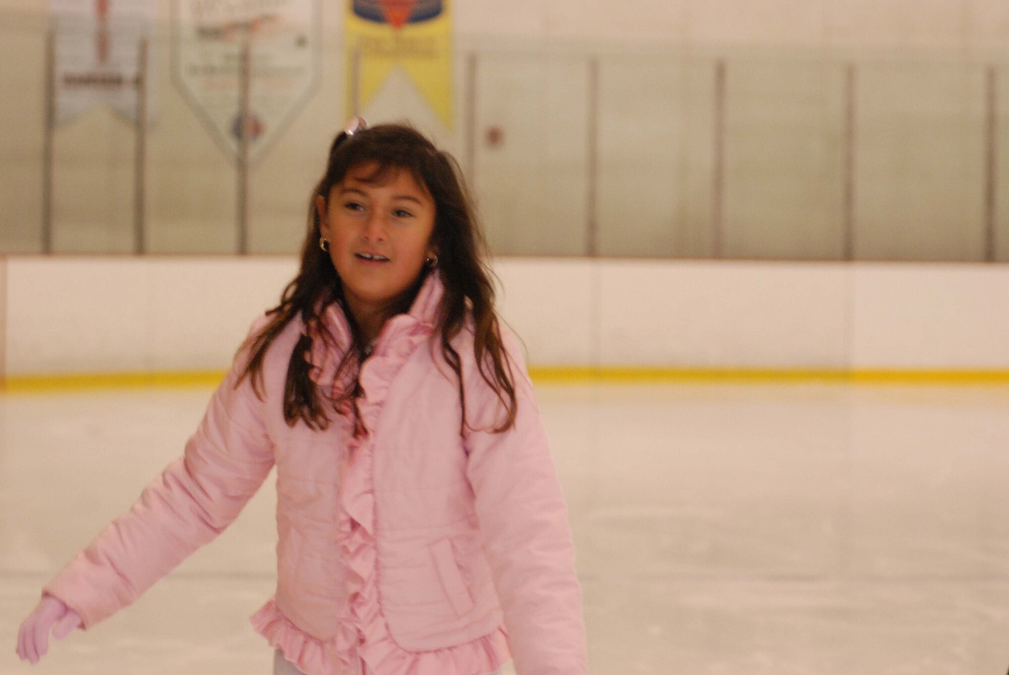 The children of March Air Reserve Base service members joined the performers of Disney on Ice Worlds of Fantasy for a free skating party at Center Ice in Ontario, Calif., Dec. 30, 2009.  After they skated with the performers, the children posed for pictures with Minnie and Mickey Mouse.  Many of the children will attend the show, which runs at Citizens Business Bank Arena in Ontario from Dec. 30 to Jan. 3, with complementary tickets.