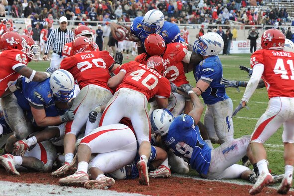 Falcons sophomore quarterback Tim Jefferson goes airborne for a touchdown on fourth and goal from the 1 during the Bell Helicopter Armed Forces Bowl in Fort Worth, Texas, Dec. 31, 2009. Jefferson, an Atlanta native, had 161 passing yards and 37 rushing yards in Air Force's 47-20 victory. (U.S. Air Force photo/Bill Evans)
