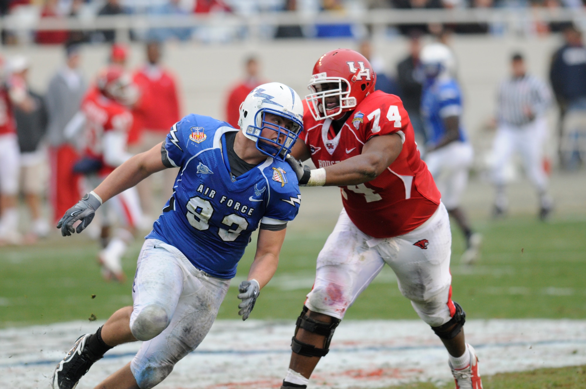 Falcons senior defensive lineman Ben Garland tries to beat a block by Cougars offensive lineman Roy Watts during the Armed Forces Bowl in Fort Worth, Texas, Dec. 31, 2009. Air Force's defense held Houston to 331 total yards and intercepted Houston quarterback Case Keenum six times in the Falcons' 47-20 victory. Garland is a native of Grand Junction, Colo. (U.S. Air Force photo/Bill Evans)