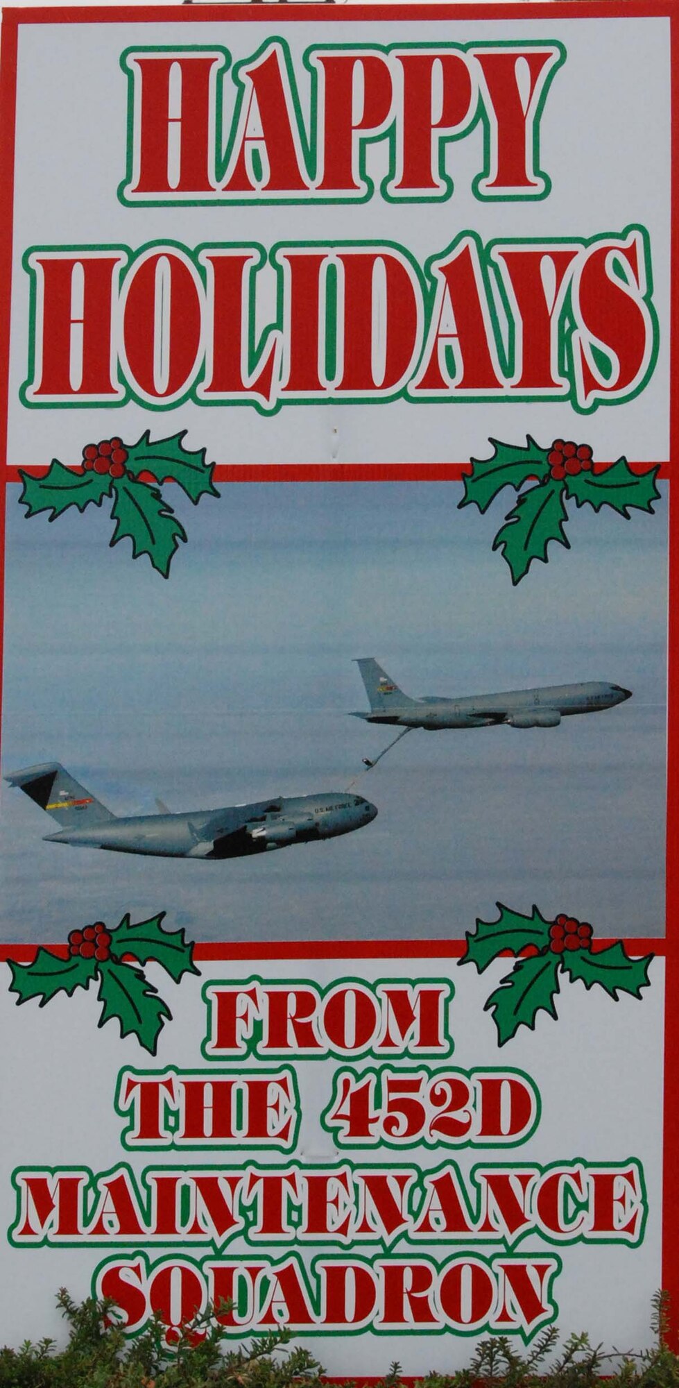 An oversize, handmade holiday greeting card lines greets Team March members as they enter and exit base Dec. 30, 2009.  Tech. Sgt. Neil Ballecer of the Blue Eagles Total Force Honor Guard at March Air Reserve Base, Calif., organized the display and more than 15 units from the base submitted cards.