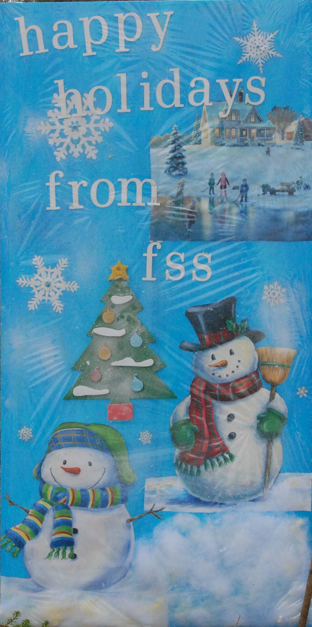 An oversize, handmade holiday greeting card lines greets Team March members as they enter and exit base Dec. 30, 2009.  Tech. Sgt. Neil Ballecer of the Blue Eagles Total Force Honor Guard at March Air Reserve Base, Calif., organized the display and more than 15 units from the base submitted cards.