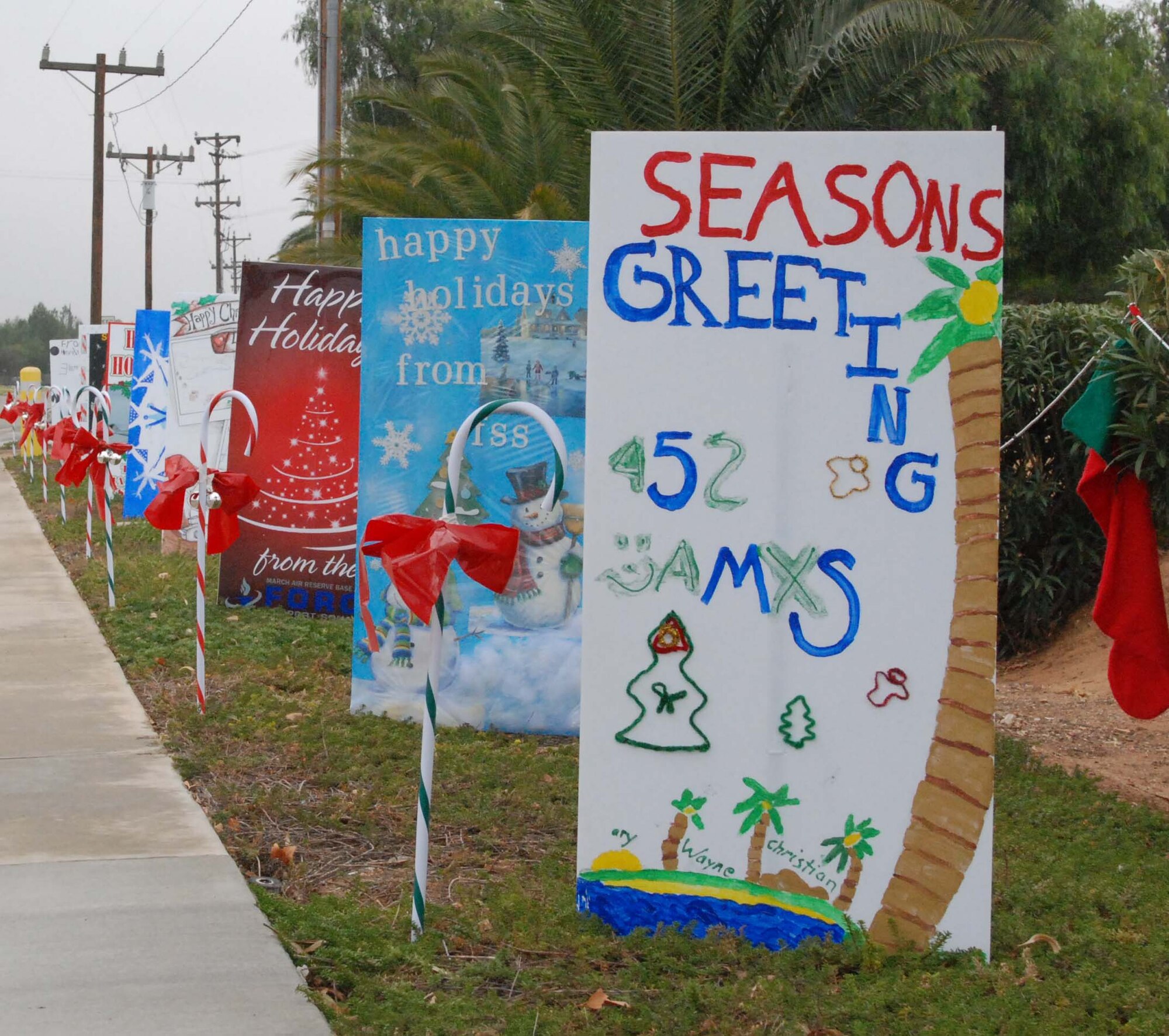 An oversize, handmade holiday greeting card lines greets Team March members as they enter and exit base Dec. 30, 2009.  Tech. Sgt. Neil Ballecer of the Blue Eagles Total Force Honor Guard at March Air Reserve Base, Calif., organized the display and more than 15 units from the base submitted cards.