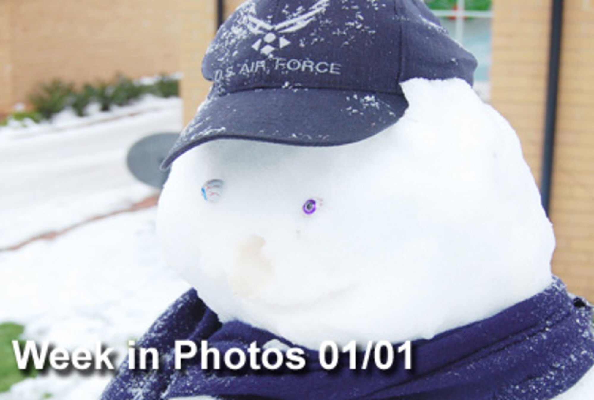 Air Force Week in Photos for Jan. 1, 2010, highlights photos from around the Air Force. In this photo by Tim Barlow, some people built snowmen in their yards in base housing at Royal Air Force Lakenheath, England, Dec. 22, 2009, after a night of heavy snow and ice. As soon as it began to warm, this snowman lost his nose.  (U.S. Air Force illustration)