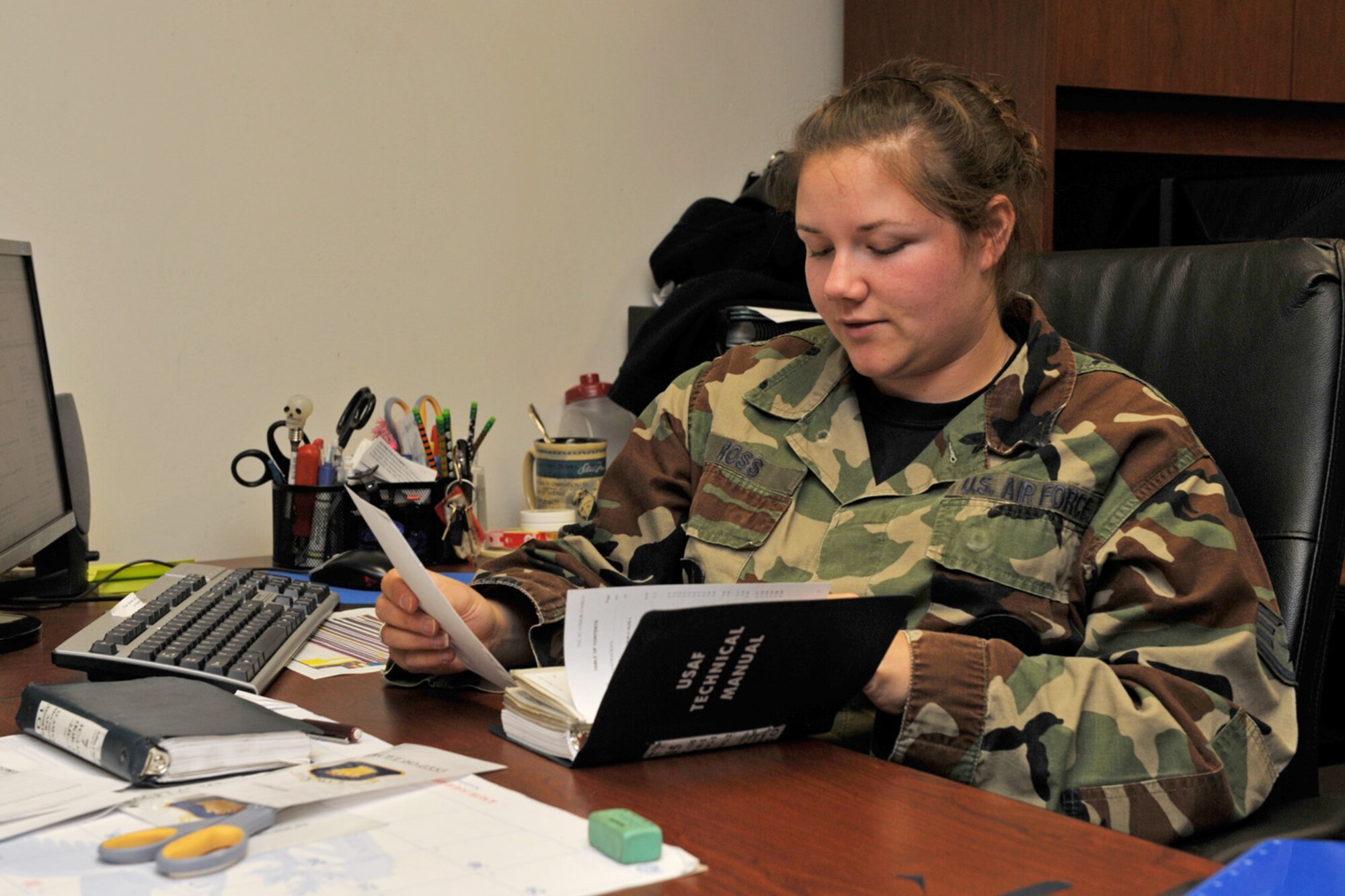 Staff Sgt. Erin Ross updates a technical manual for the maintenance Airmen of the 22nd Air Refueling Wing at McConnell Air Force Base, Kan. Sergeant Ross, an aircraft maintenance crew chief assigned to the 931st Air Refueling Group, is one of many 931st Reservists who filled vacancies created by deployment within the 22nd ARW, the 931st's active-duty host unit, in 2009. (U.S. Air Force photo/Master Sgt. Jason Schaap)