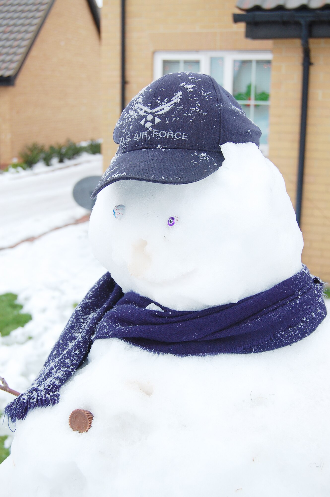 After a night of heavy snow and ice, some people built snowmen in their yards in base housing at Royal Air Force Lakenheath, England, Dec. 22, 2009. The winter weather made road conditions hazardous and resulted in the base shutting down for the day. As soon as it began to warm, this snowman lost his nose.  (U.S. Air Force photo/Tim Barlow)