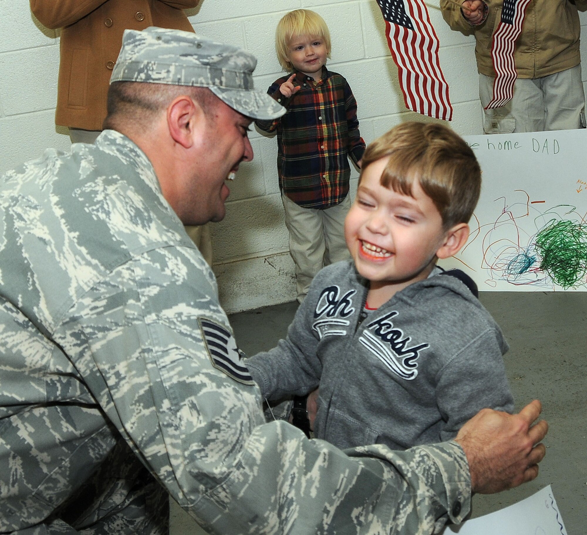 In a Dec. 30 reception, Tech. Sgt. Corey Morris greets his son Skyler after a six-month deployment to Southwest Asia. Friends and familiy greeted Reservists from the 403rd Wing Security Forces Squadron.