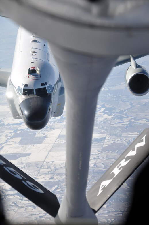An RC-135 pulls up to the boom of a KC-135 for air refueling. (Air Force photo/Tech. Sgt. Bob Sommer)