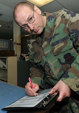 OFFUTT AIR FORCE BASE, Neb. -- Master Sgt. Russell G. Dowe, chief of quality assurance for the 55th Strategic Communications Squadron's standards and evaluations office, poses for a photo inside Bldg. 456 here Dec. 17. As the chief of the 55th SCS QA office, Sergeant Dowe is responsible for validating technician’s skills, equipment installations and program compliance. Sergeant Dowe is also an avid volunteer in the local community. U.S. Air Force Photo by Charles Haymond
