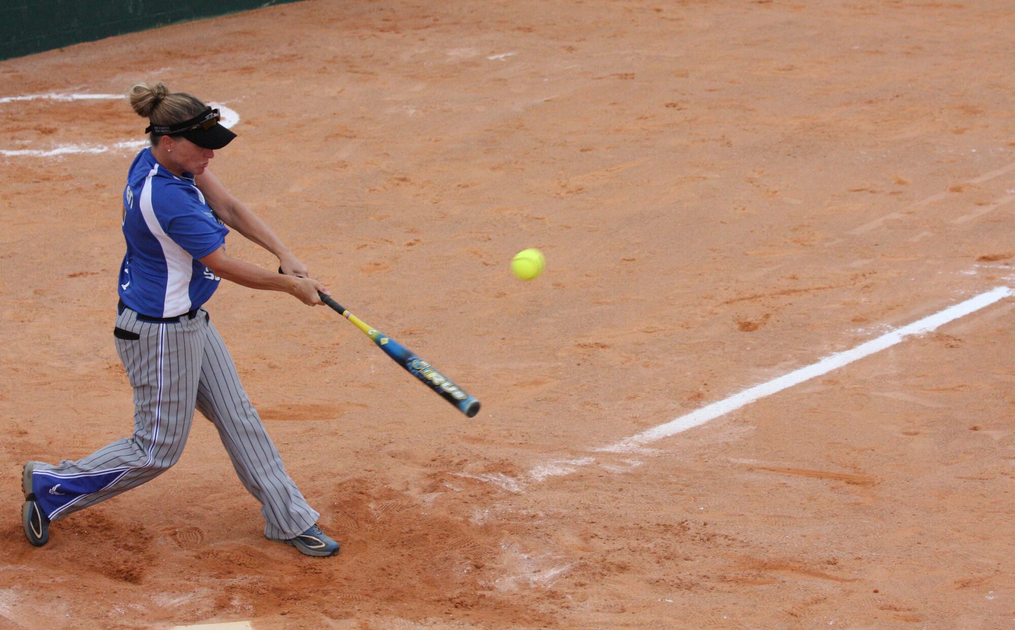 Master Sgt. Karrie Warren takes a swing from the plate during the 2009 Armed Forces Tournament held at Naval Air Station Pensacola, Fla., Sept. 19-24. Sergeant Warren, assigned to the 601st Air and Space Operations Center at Tyndall Air Force Base, Fla., was awarded the 2009 U.S. Air Force Female Athlete of the Year. (U.S. Air Force photo/Steve Brown)