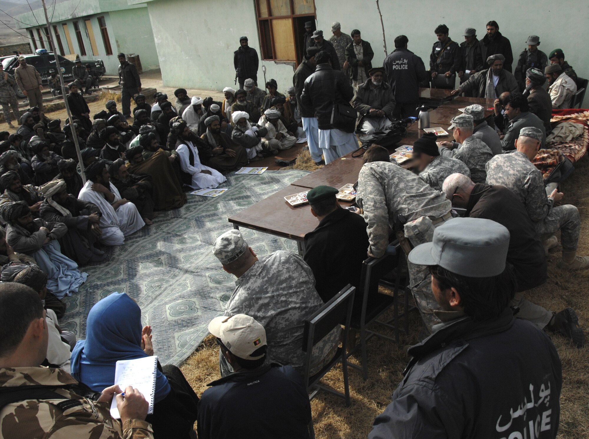 ZABUL PROVINCE, Afghanistan -- Afghan nationals and members of the U.S. and other coalition forces gather at the Arghandab District Center in the Zabul province prior to Arghandab Bridge opening ceremony Dec. 26, 2009. (U.S. Air Force photo/Senior Airman Timothy Taylor)