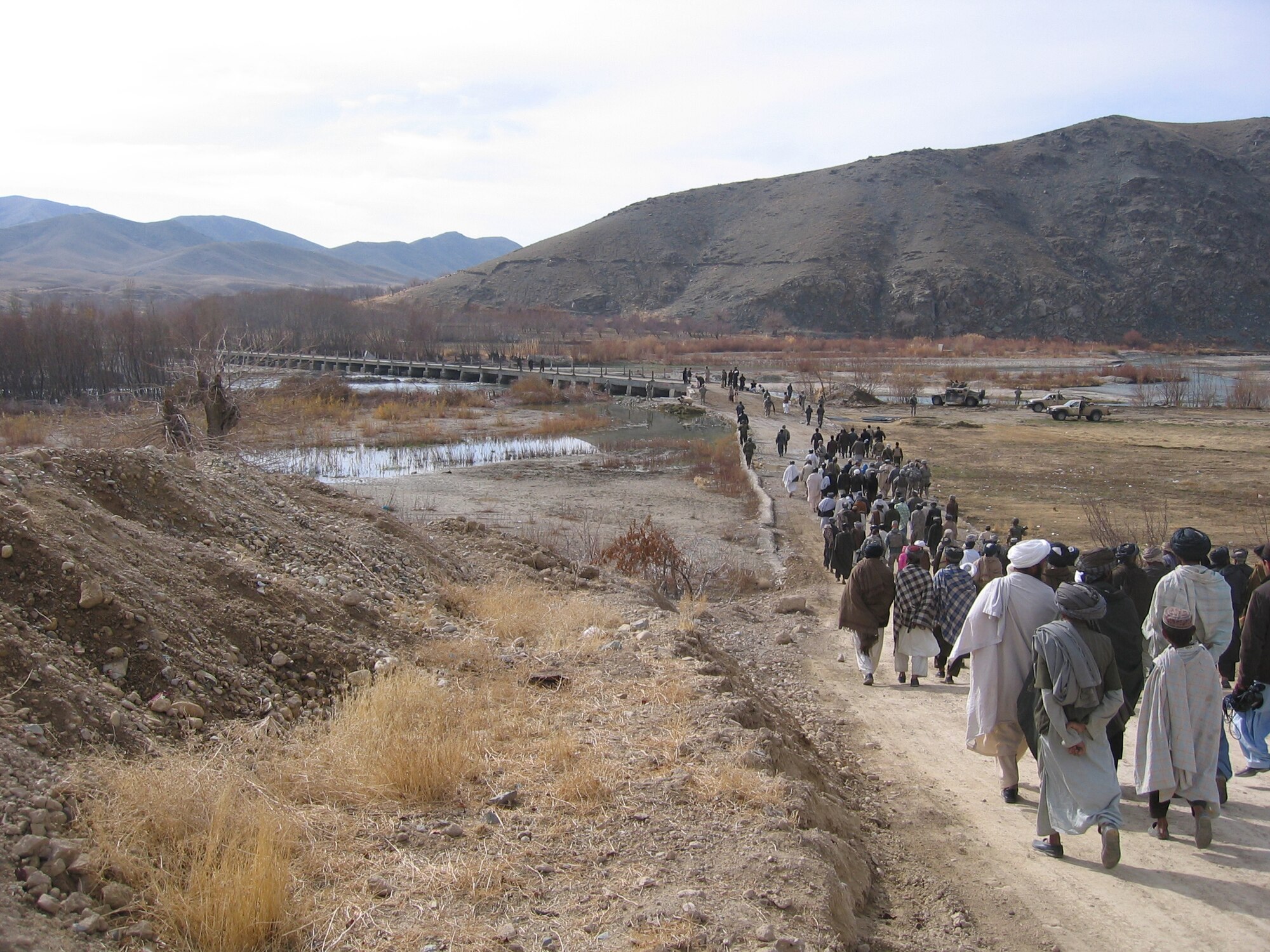 ZABUL PROVINCE, Afghanistan -- U.S. military servicemembers and Afghans celebrated the opening of the Arghandab Bridge Dec. 26, 2009.  This bridge is approximately 200 meters long, four meters wide and has a high load-bearing capacity.  Although simple, this bridge allows easy maintenance for the Afghans.  (U.S. Air Force photo/Maj. Dru Dickerson)     