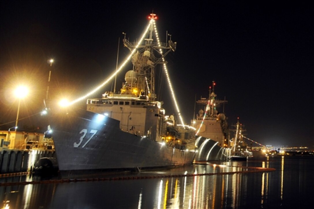 The guided-missile frigate USS Crommelin, ported in Pearl Harbor, Hawaii, displays its holiday lights during the annual Navy contest, Dec. 23, 2009. 