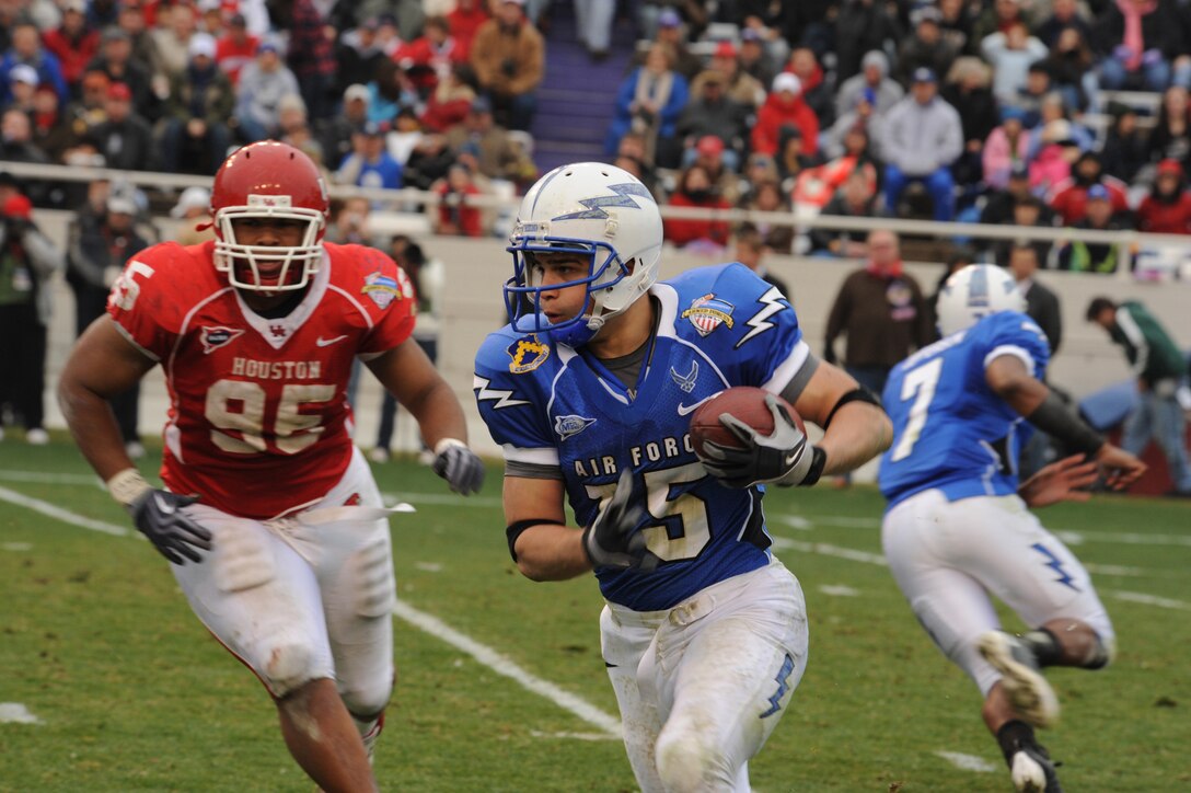 U.S. Air Force Academy tailback Asher Clark rushes for five yards to the University of Houston's 24-yard line during the second quarter of the 2009 Armed Forces Bowl football game at Amon G. Carter Stadium here New Year's Eve.  The Air Force Falcons defeated the Cougars by the score of 47-20.