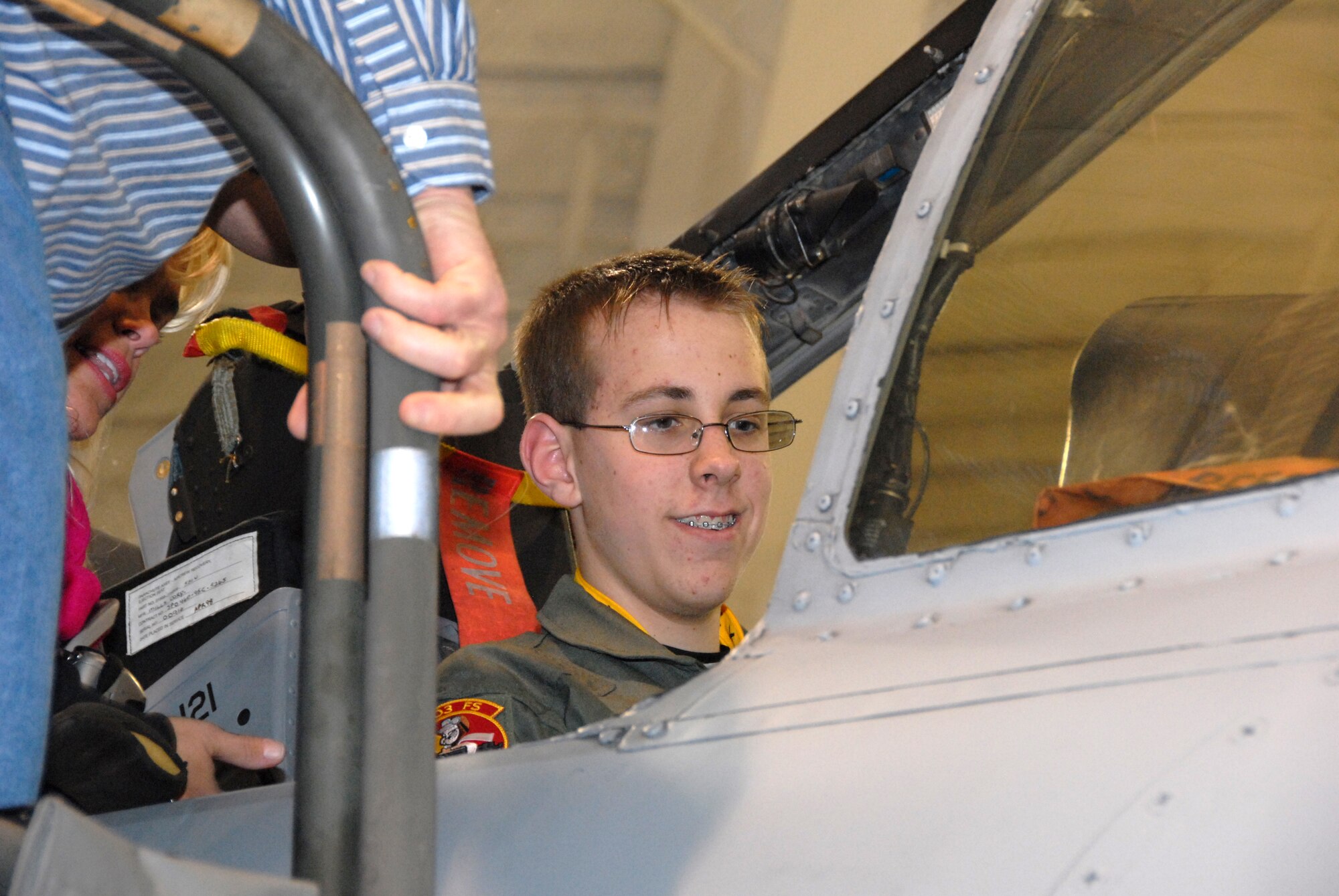 Thirteen-year-old Wyatt Maurer, shows his parents, Stephanie and Andrew Maurer, the inside of an A-10 Thunderbolt II during his "pilot for a day" experience at the 303rd Fighter Squadron Jan. 11.  Wyatt was  treated to a simulator "ride," as well as a tour of an actual A-10 and a day in the life of an A-10 pilot.  The visit was made possible by the Greater Kansas City chapter of the Dream Factory, which arranges special memories for children with serious or chronic medical conditions.  The 303rd is part of the 442nd Fighter Wing, an Air Force Reserve Command unit based at Whiteman Air Force Base, Mo.  (U.S. Air Force photo/Maj. David Kurle)