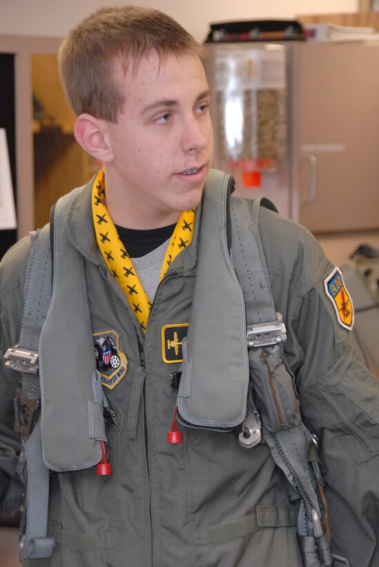 Thirteen-year-old Wyatt Maurer, tries out a parachute harness and life preserve during his "pilot for a day" experience at the 303rd Fighter Squadron Jan. 11.  Wyatt was treated to a ride in the squadron's A-10 Thunderbolt II Flight Simulator, a tour of an actual A-10 and a day in the life of an A-10 pilot.  The visit was made possible by the Greater Kansas City chapter of the Dream Factory, which arranges special memories for children with serious or chronic medical conditions.  The 303rd is part of the 442nd Fighter Wing, an Air Force Reserve Command unit based at Whiteman Air Force Base, Mo.  (U.S. Air Force photo/Maj. David Kurle)